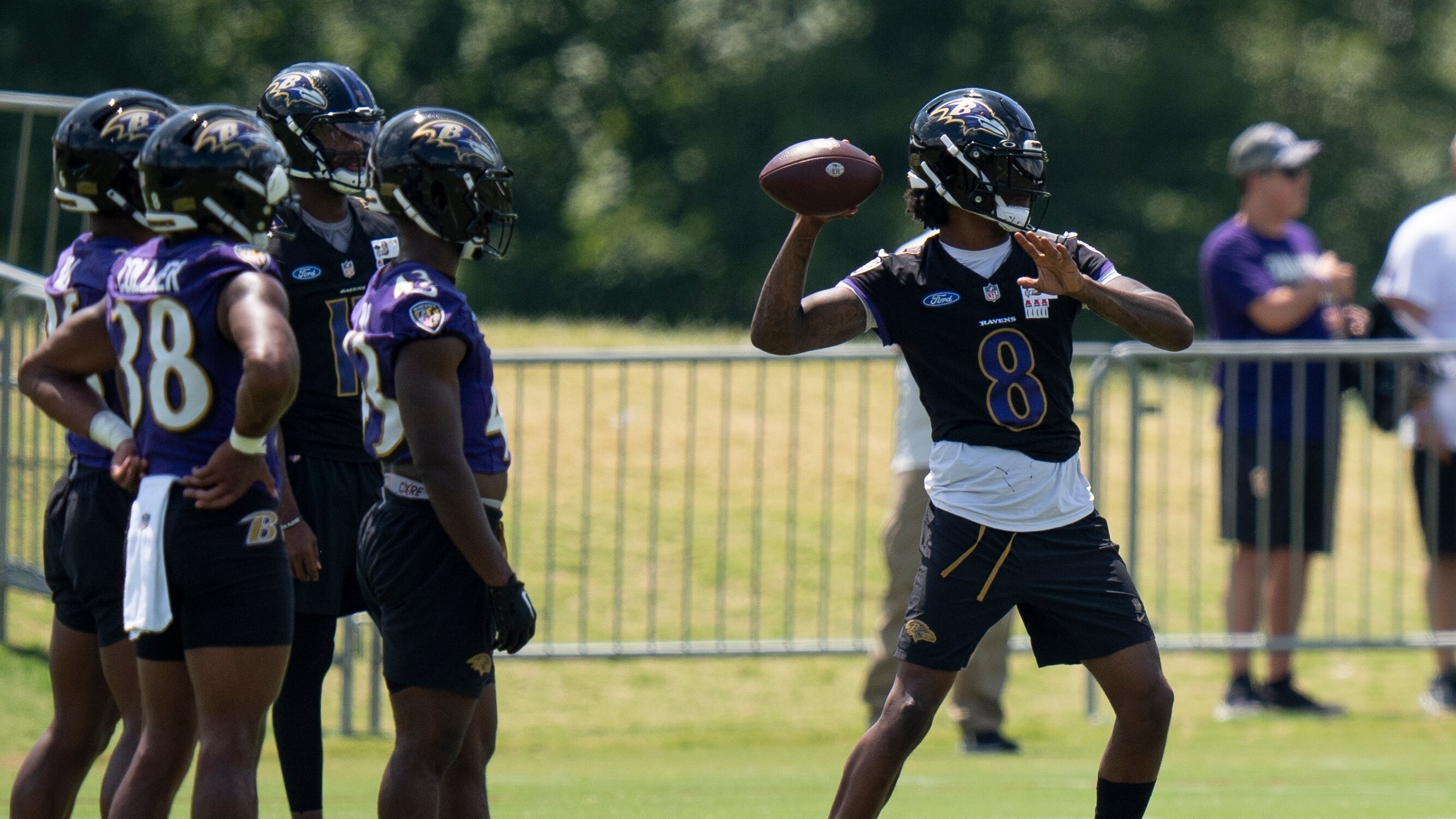 Baltimore Ravens quarterback Lamar Jackson, right, works out during NFL football training camp Friday, Aug. 2, 2024, in Owings Mills, Md. (AP Photo/Stephanie Scarbrough)