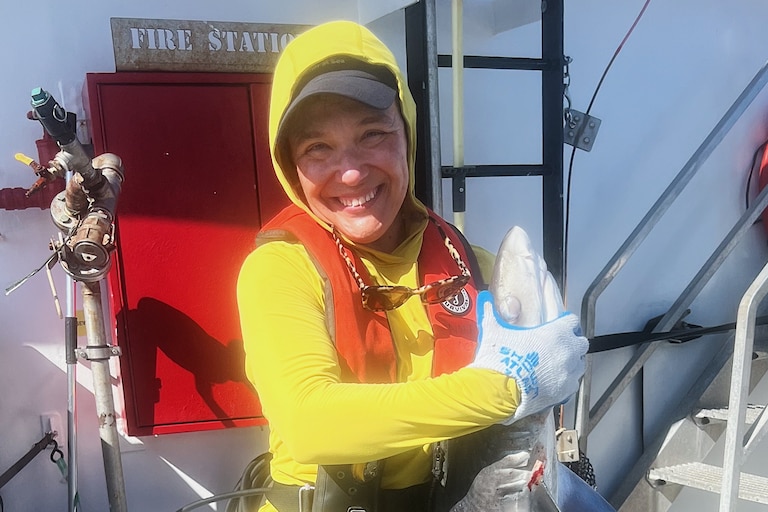 Special education teacher Cheyanne Vanderdonckt was originally scared to hold a tiger shark, but knew she had to do it before ending her journey aboard the Oregon II.