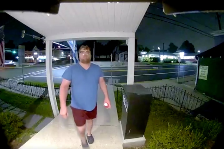 A still from surveillance footage taken on a Ring camera outside of Kitchen Design by Iran shows Jonathon Wagner just before taping over the camera lens.