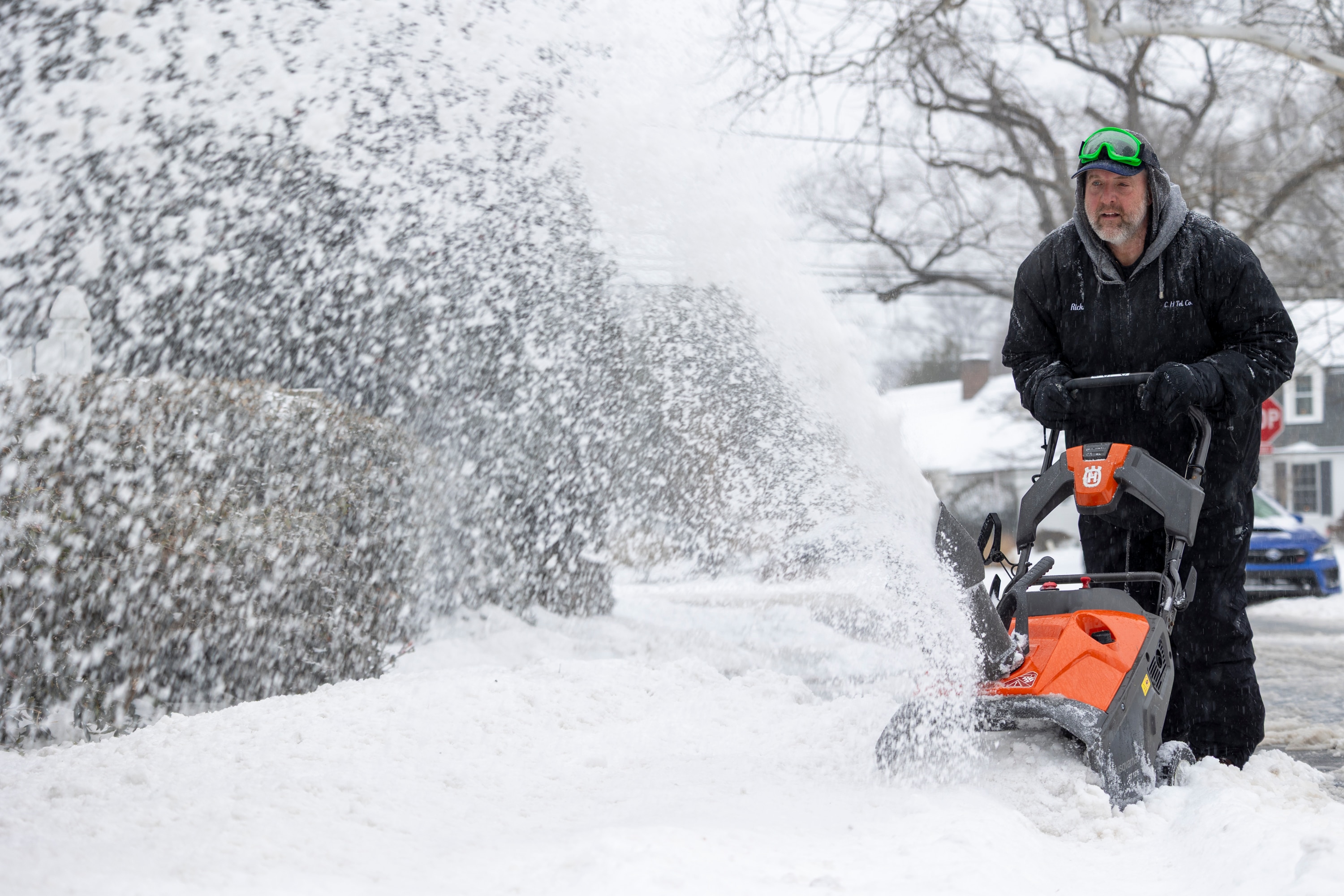 Rick Golladay uses a snowblower on Sunday, Jan. 25, 2026, in Silver Spring, Md. during a snowstorm.