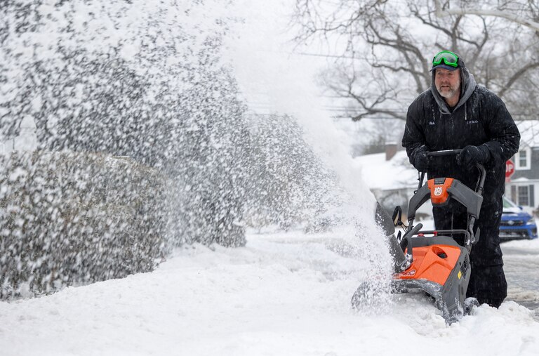 Rick Golladay uses a snowblower on Sunday, Jan. 25, 2026, in Silver Spring, Md. during a snowstorm.