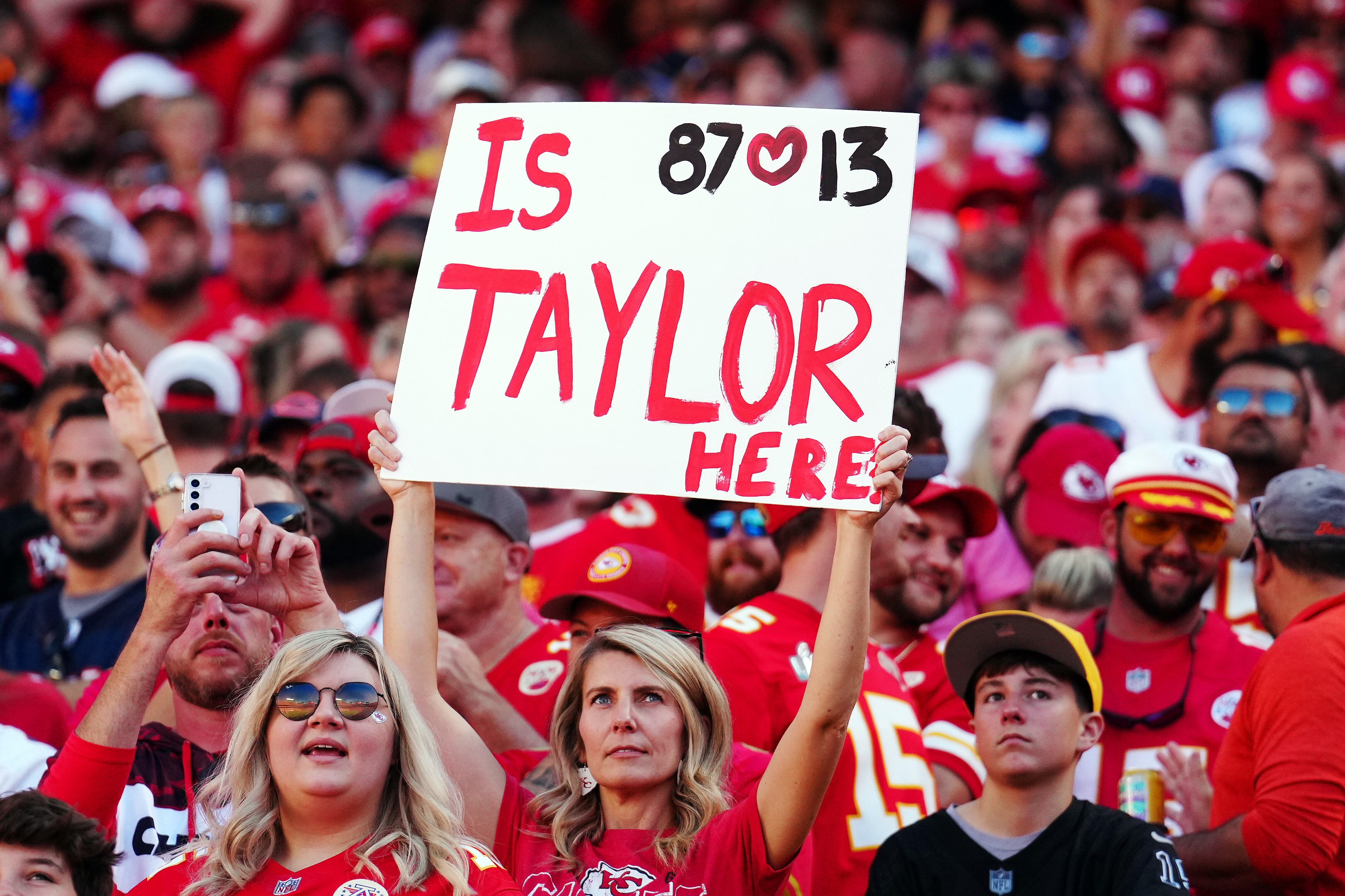 A Taylor Swift fan holds a sign during a game between the Chicago Bears and the Kansas City Chiefs at GEHA Field at Arrowhead Stadium on Sept. 24, 2023 in Kansas City, Missouri. (Photo by Jason Hanna/Getty Images)