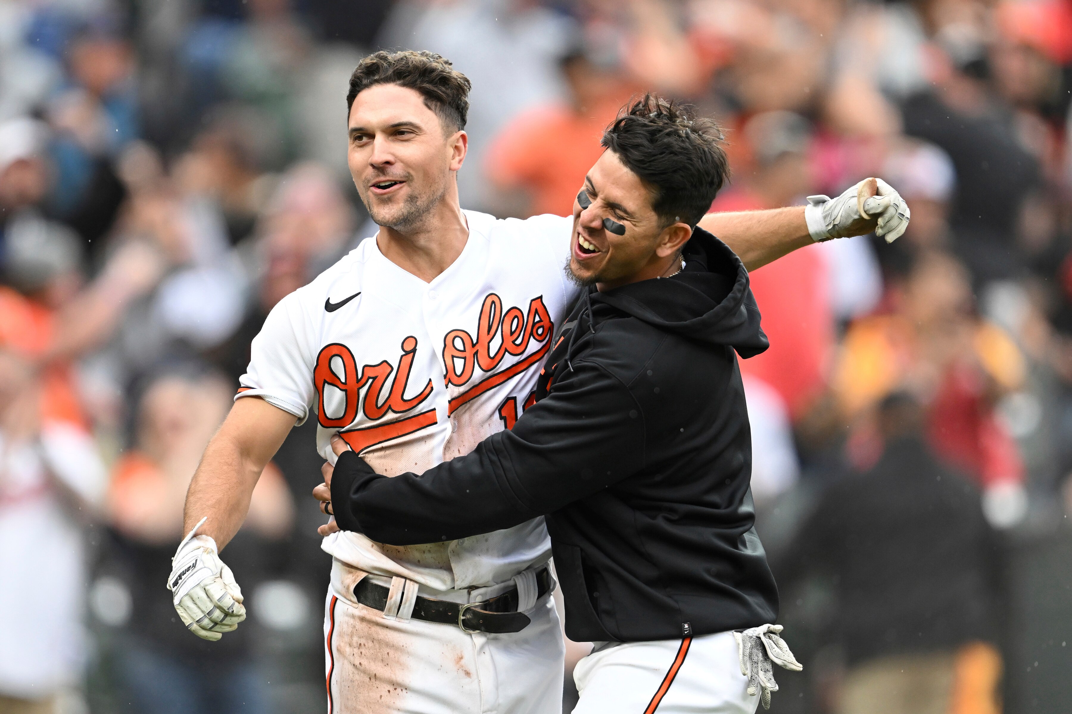 Baltimore Orioles' Adam Frazier, left, is greeted by Ramon Urias after he scored the winning run on a wild pitch by Detroit Tigers pitcher Mason Englert in the tenth inning of a baseball game, Sunday, April 23, 2023, in Baltimore. The Orioles won 2-1.