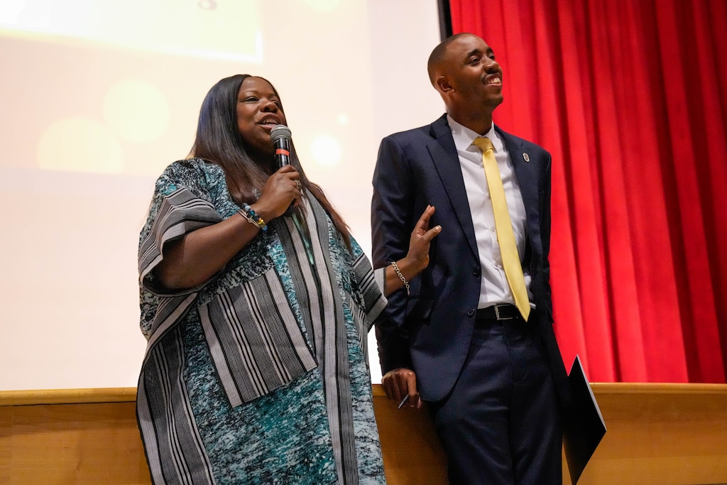Prince George’s County Executive Aisha Braveboy, left, stands next to County Council member Edward Burroughs as she gives remarks during Joan’s House’s Student Leadership Academy graduation ceremony at Crossland High School in Camp Springs, Md. on Wednesday, June 3, 2026.