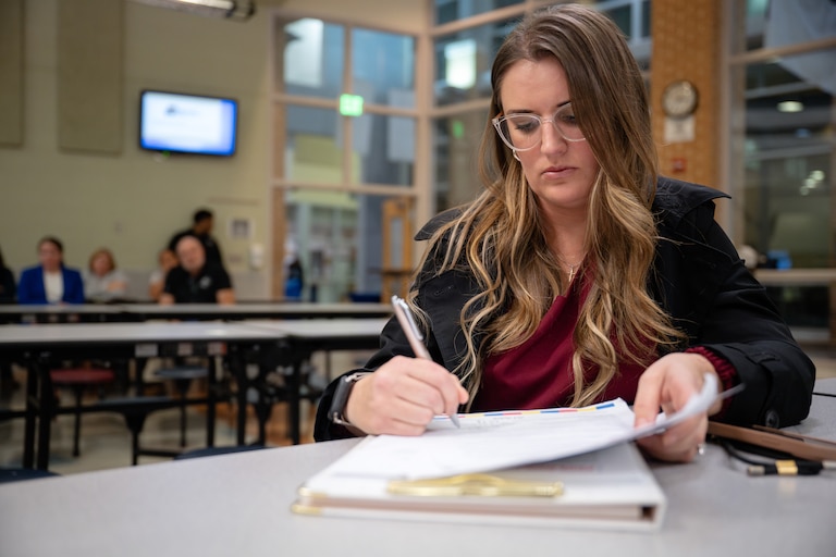Jennifer Sawyer Hathaway, a Harford County School System parent and advocate helping to organize parents, listens to a budget shortfall presentation by Harford County Schools Superintendent Dr. Sean Bulson on November 20, 2024, in Aberdeen, Md.