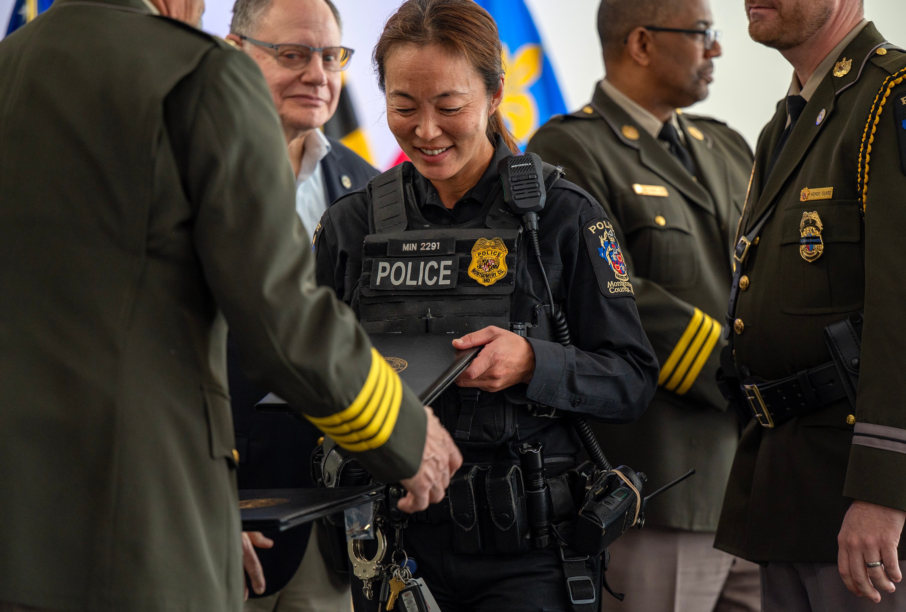 Montgomery County Police officer Susanne Min receives a Lifesaving Award during the Montgomery County Department of Police Awards Ceremony on Wednesday in Gaithersburg. 