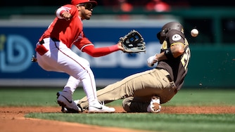 San Diego Padres' Nick Castellanos, right, steals second base against Washington Nationals second baseman Jorbit Vivas, left, during the third inning of a baseball game, Sunday, May 31, 2026, in Washington.