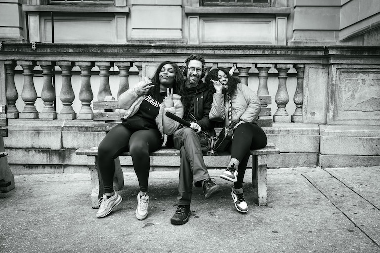 Aaron Henkin of WYPR with two interviewees, Courtanae and Nicole, outside of Courthouse East on January 11, 2022.