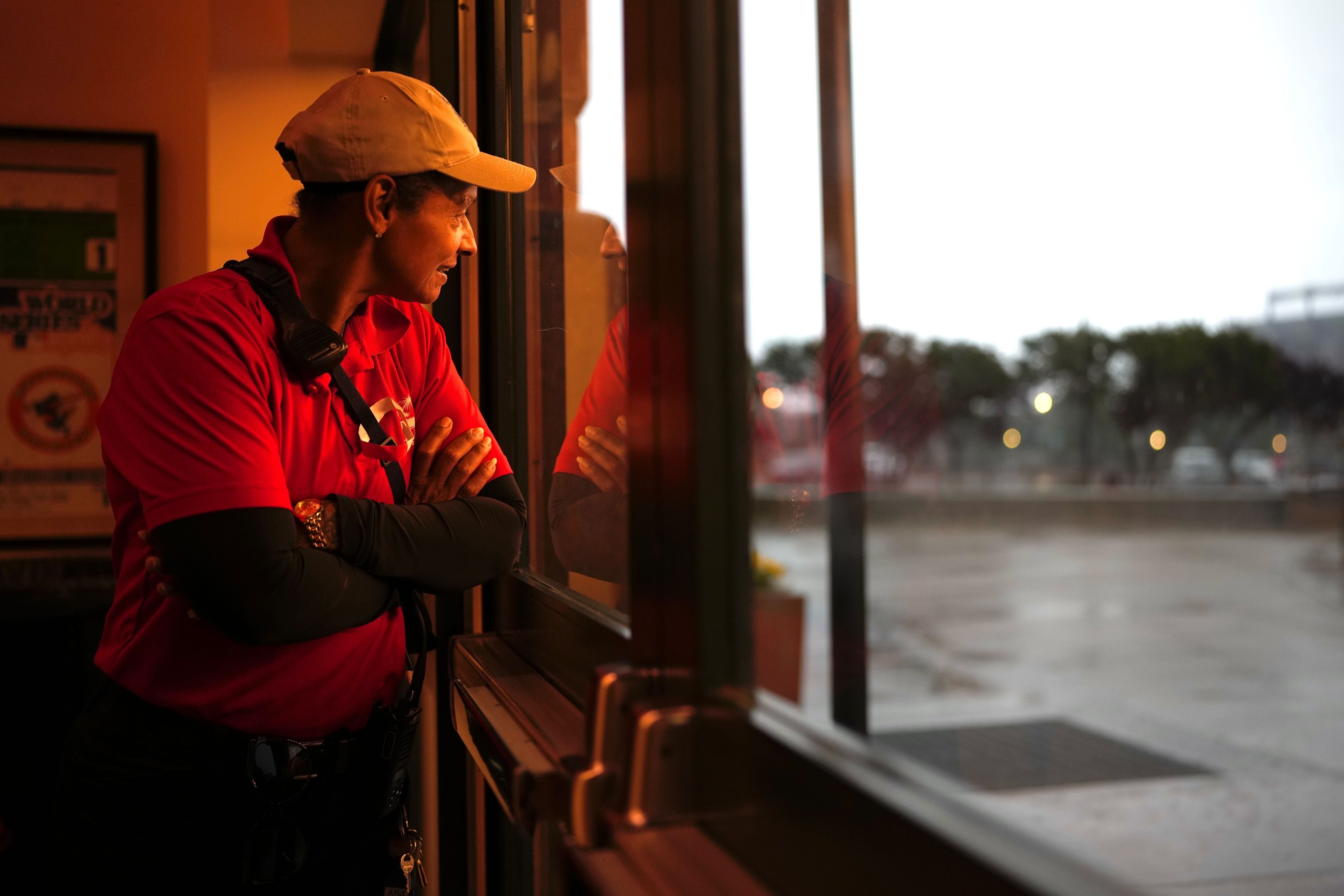 Katrina Schmidt watches a storm grow stronger from inside the lobby of Camden Yards on Friday, May 30, 2025.