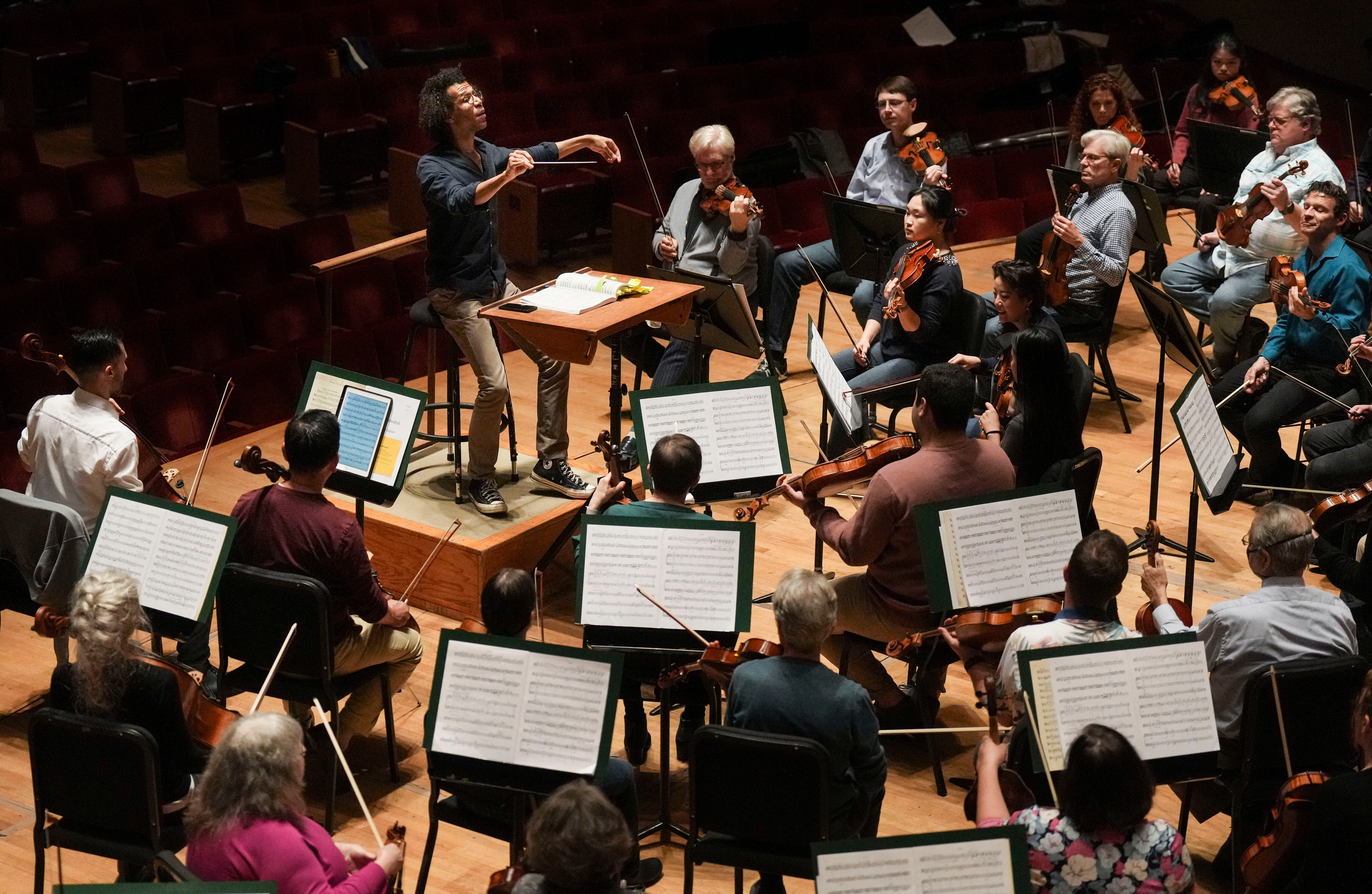 Jonathon Heyward, Music Director of the Baltimore Symphony Orchestra goes through rehearsal at Joseph Meyerhoff Symphony Hall, Tuesday, May 2, 2023.