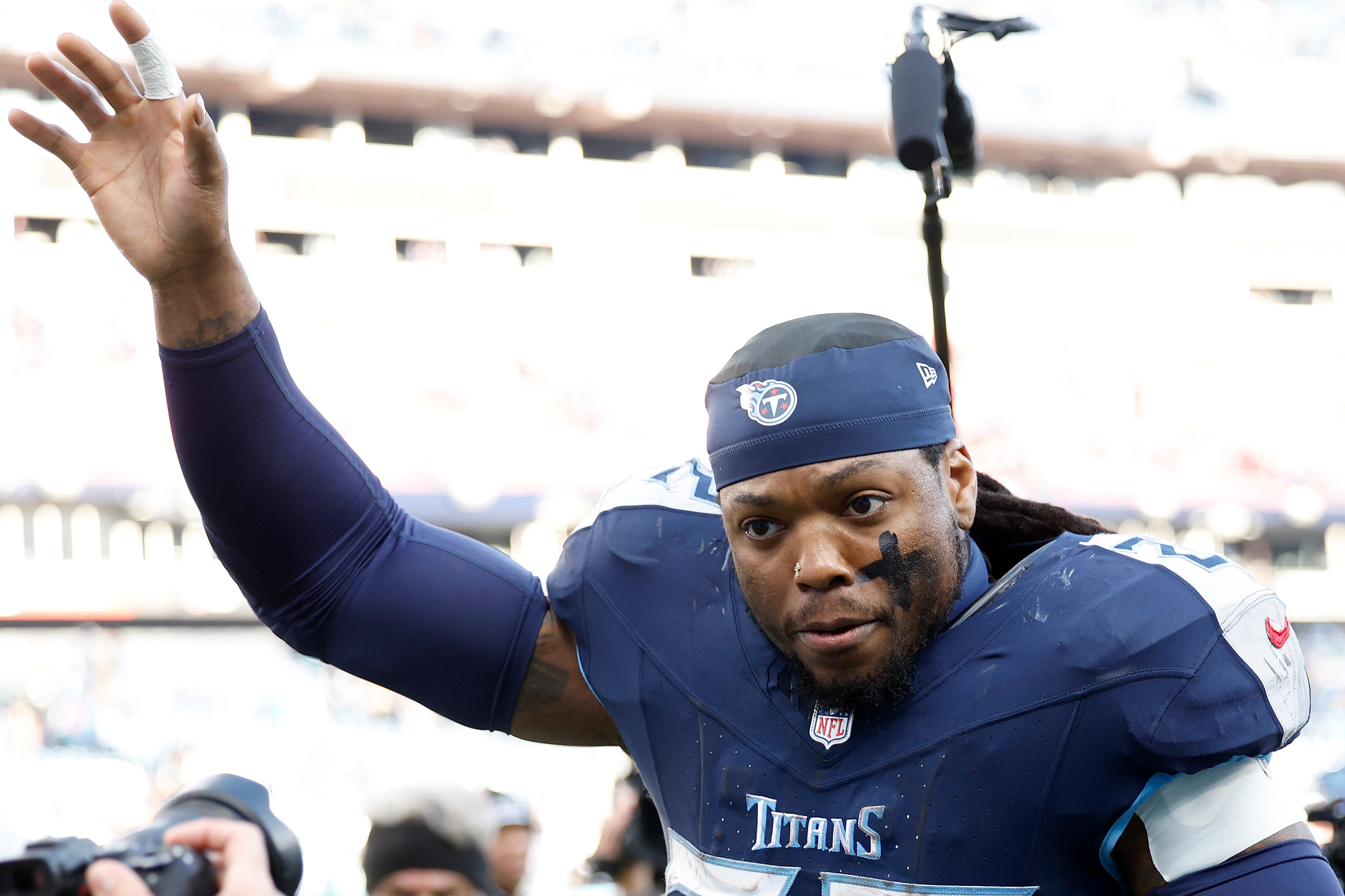 Derrick Henry, #22 of the Tennessee Titans, runs off the field after the game against the Jacksonville Jaguars at Nissan Stadium on Jan. 7, 2024 in Nashville, Tennessee.