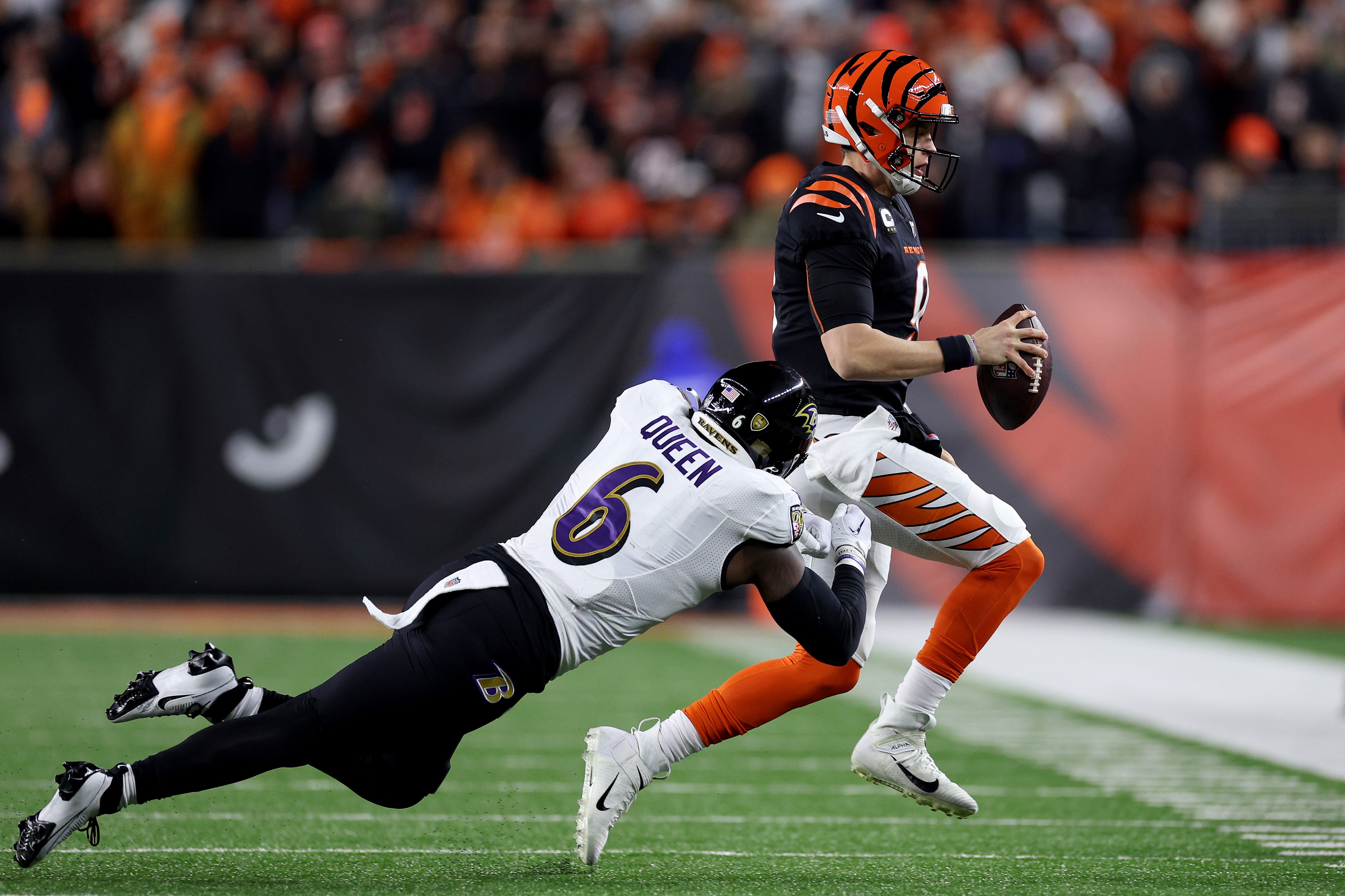 Patrick Queen #6 of the Baltimore Ravens knocks Joe Burrow #9 of the Cincinnati Bengals out of bounds during the first quarter in the AFC Wild Card playoff game at Paycor Stadium on January 15, 2023 in Cincinnati, Ohio.