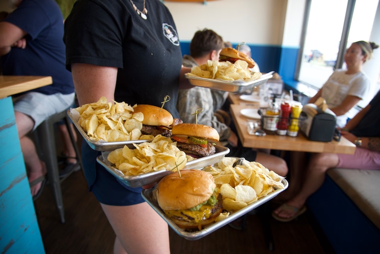 Local pasture-raised beef is cooked double-patty style at Surfin Betty’s Burger Bar.