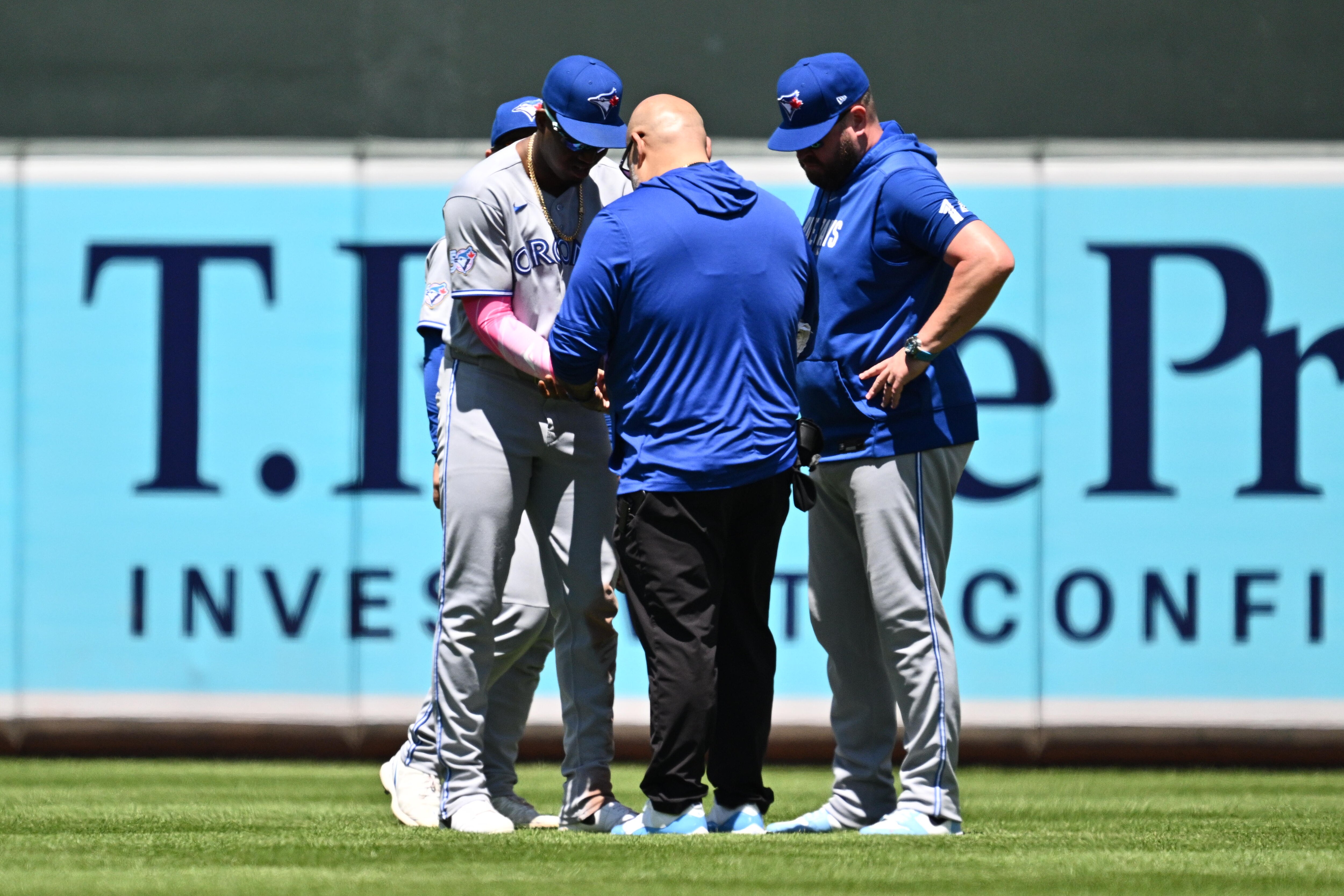 BALTIMORE, MD - MAY 31:  Jesús Sánchez #12 of the Toronto Blue Jays is checked by a trainer after a ball thrown from the outfield stands struck him in the sixth inning against the Baltimore Orioles at Oriole Park at Camden Yards on May 31, 2026 in Baltimore, Maryland. Sánchez would leave the game after the incident.