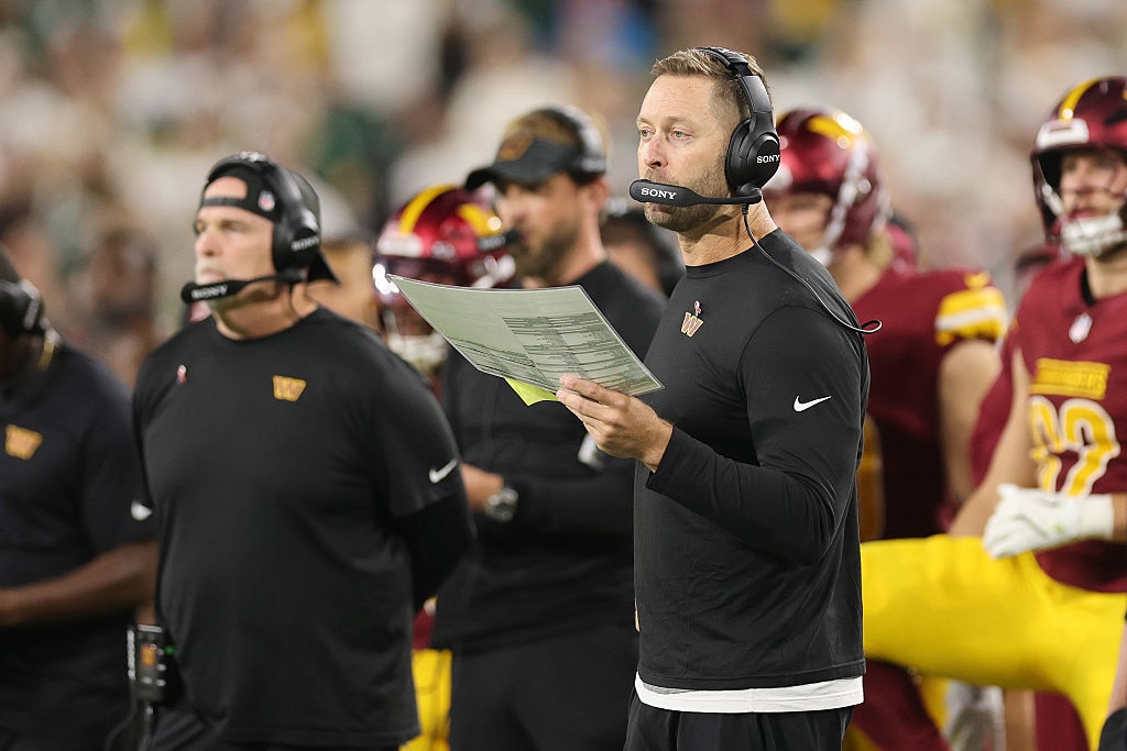 Former Washington Commanders offensive coordinator Kliff Kingsbury looks on during the team's Week 2 against the Green Bay Packers.