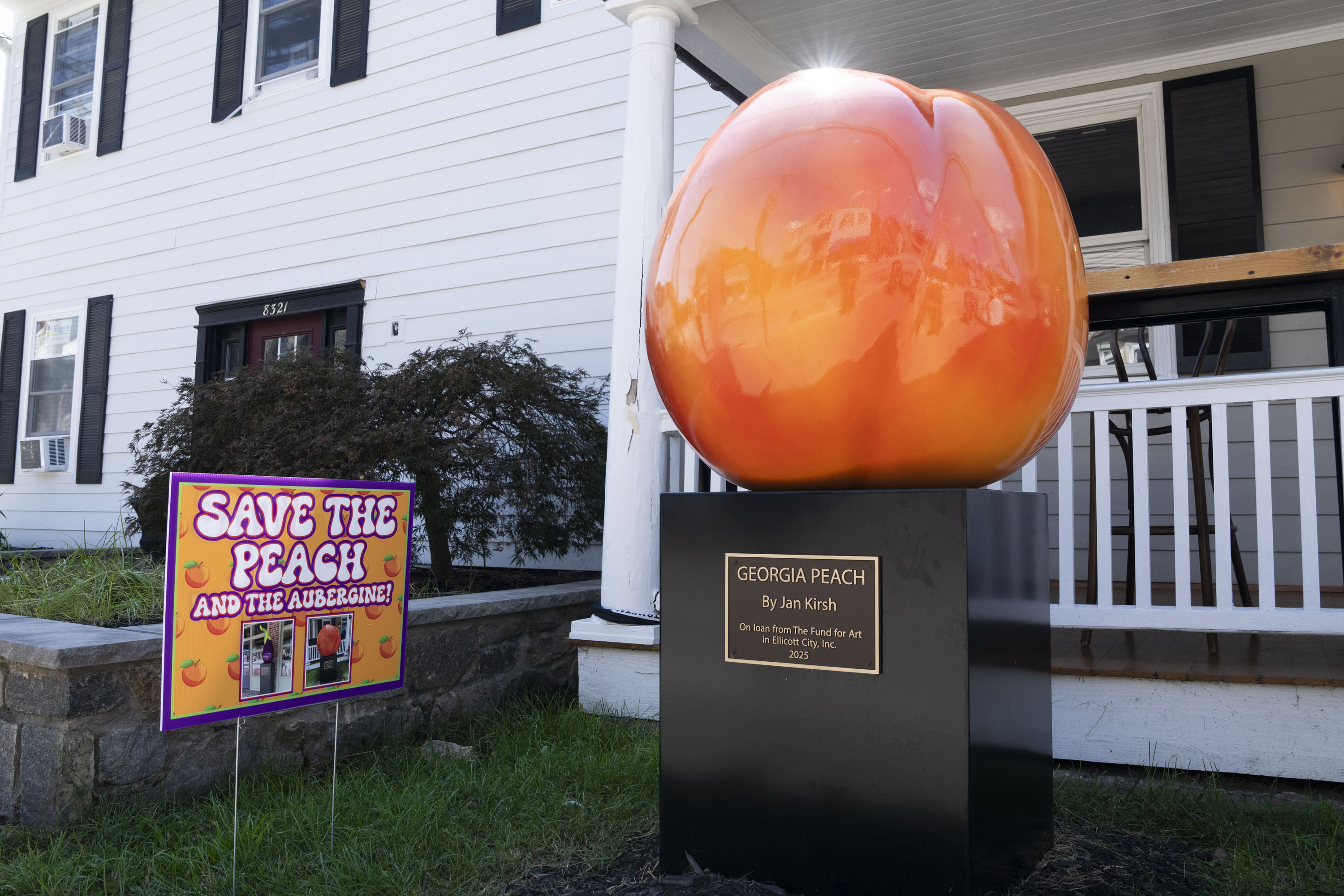 The peach sculpture by Jan Kirsh, currently on display outside of Georgia Grace Cafe on Main Street in Ellicott City.