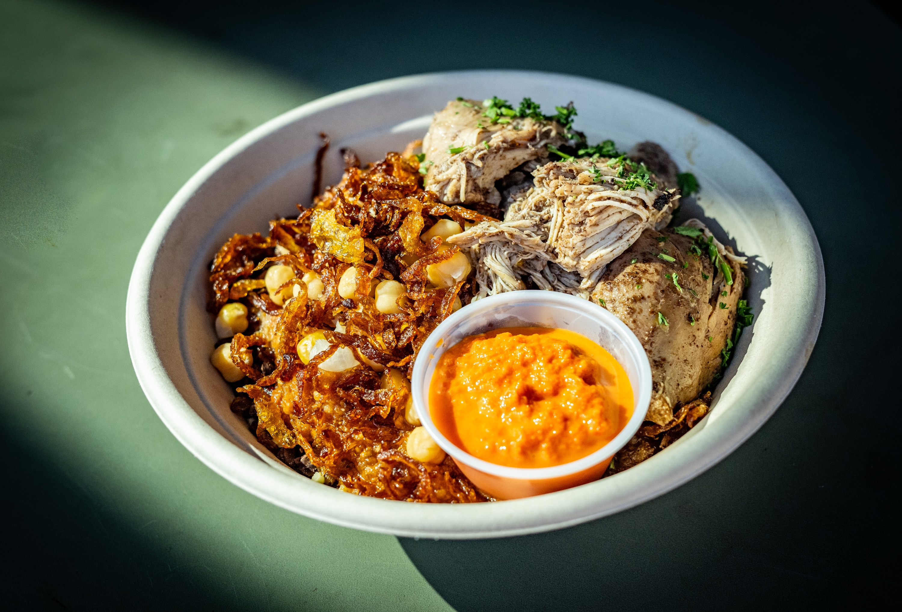 A koshary bowl with chicken from Koshary Corner at R. House in Remington.