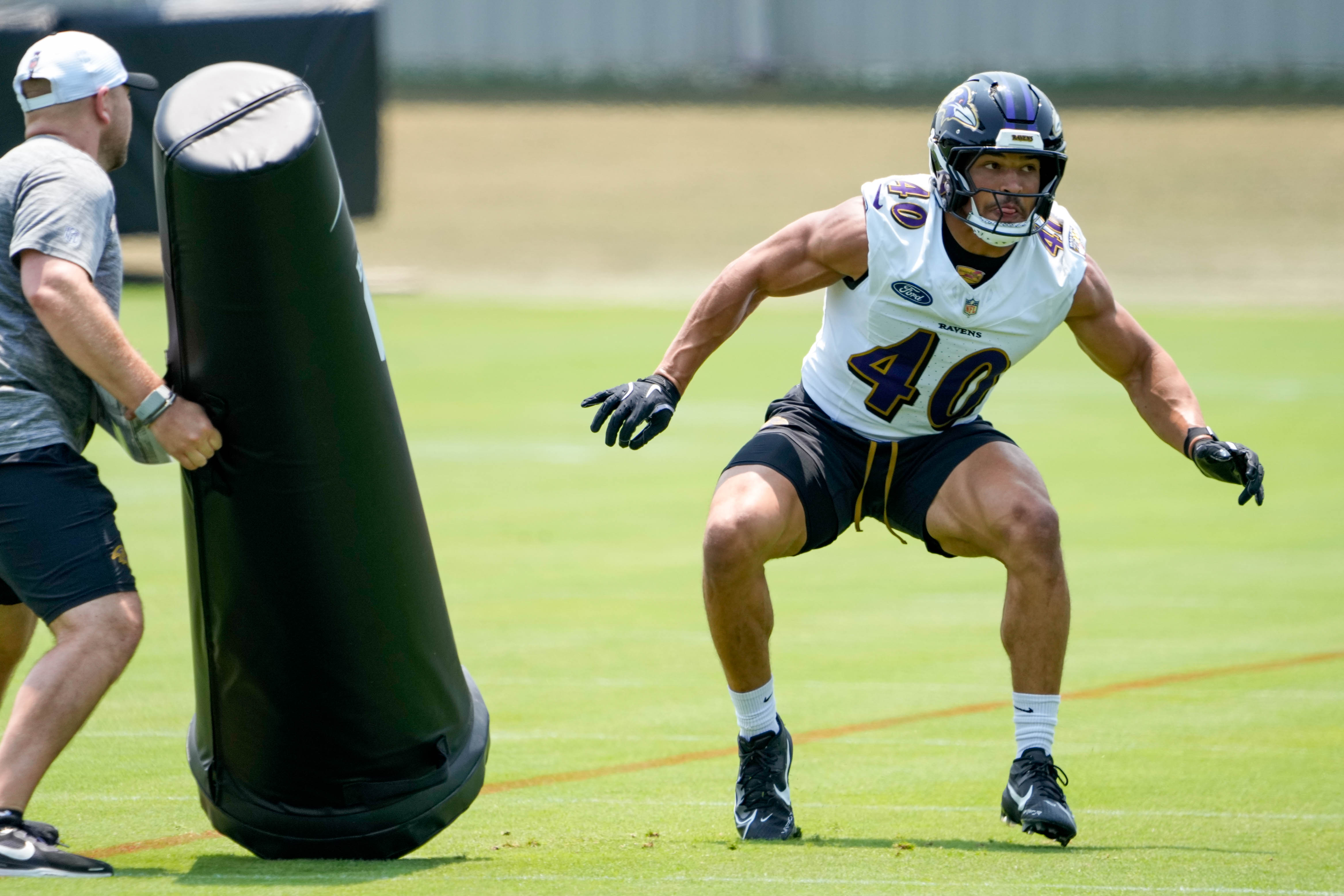 Baltimore Ravens linebacker Teddye Buchanan (40) runs a drill during the Ravens’ organized team activities at the Under Armour Performance Center in Owings Mills, Md. on Wednesday, June 11, 2025.