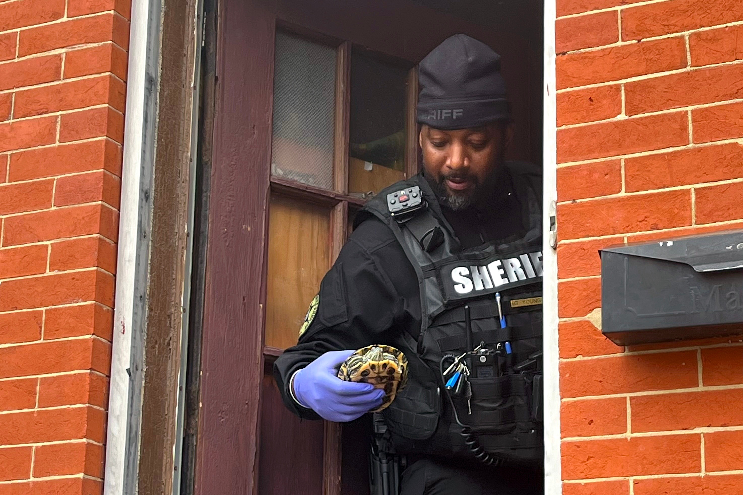 Baltimore sheriff's office rescued 65 reptiles and a dog after the owner unexpectedly passed away.