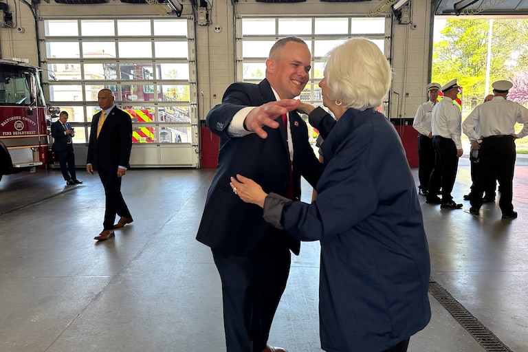 WEDNESDAY, APRIL 15, 2026 - WEDNESDAY, APRIL 15, 2026 - Steve Redmer, president of Baltimore County firefighters union IAFF Local 1311, embraces County Executive Kathy Klausmeier after a news conference Wednesday at the Towson fire station to announce increased funding for the fire department.