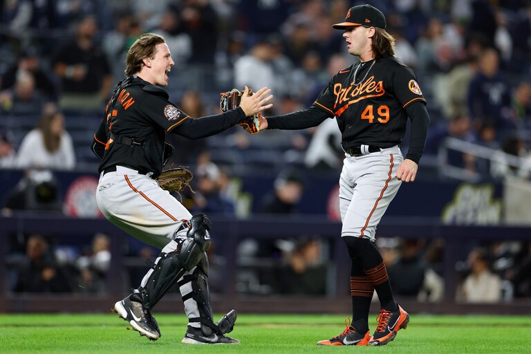 NEW YORK, NEW YORK - SEPTEMBER 30: Adley Rutschman #35 and DL Hall #49 of the Baltimore Orioles celebrate the win over the New York Yankees at Yankee Stadium on September 30, 2022 in the Bronx borough of New York City. The Baltimore Orioles defeated the New York Yankees 2-1.