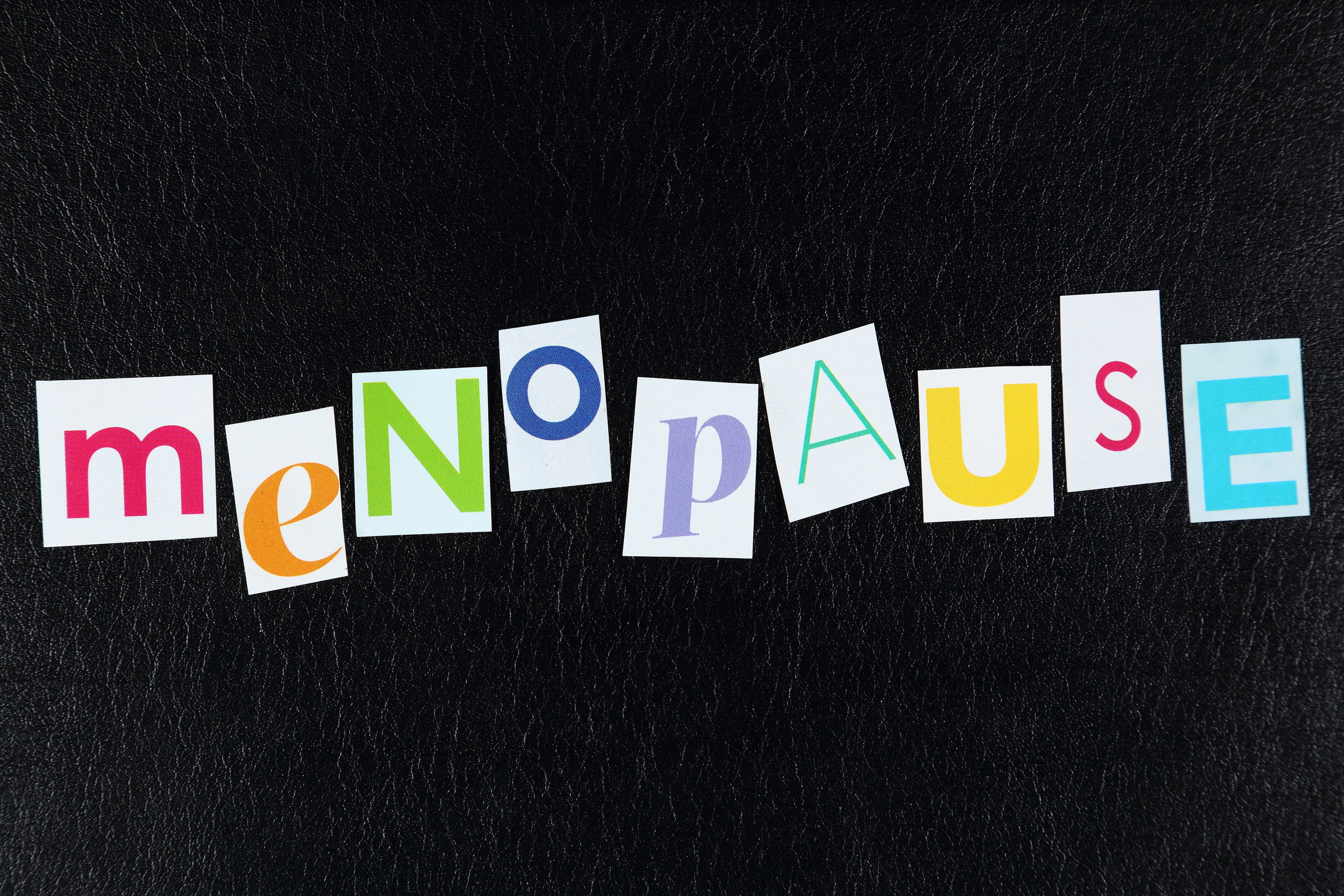 Menopause written with cut out magazine letters.