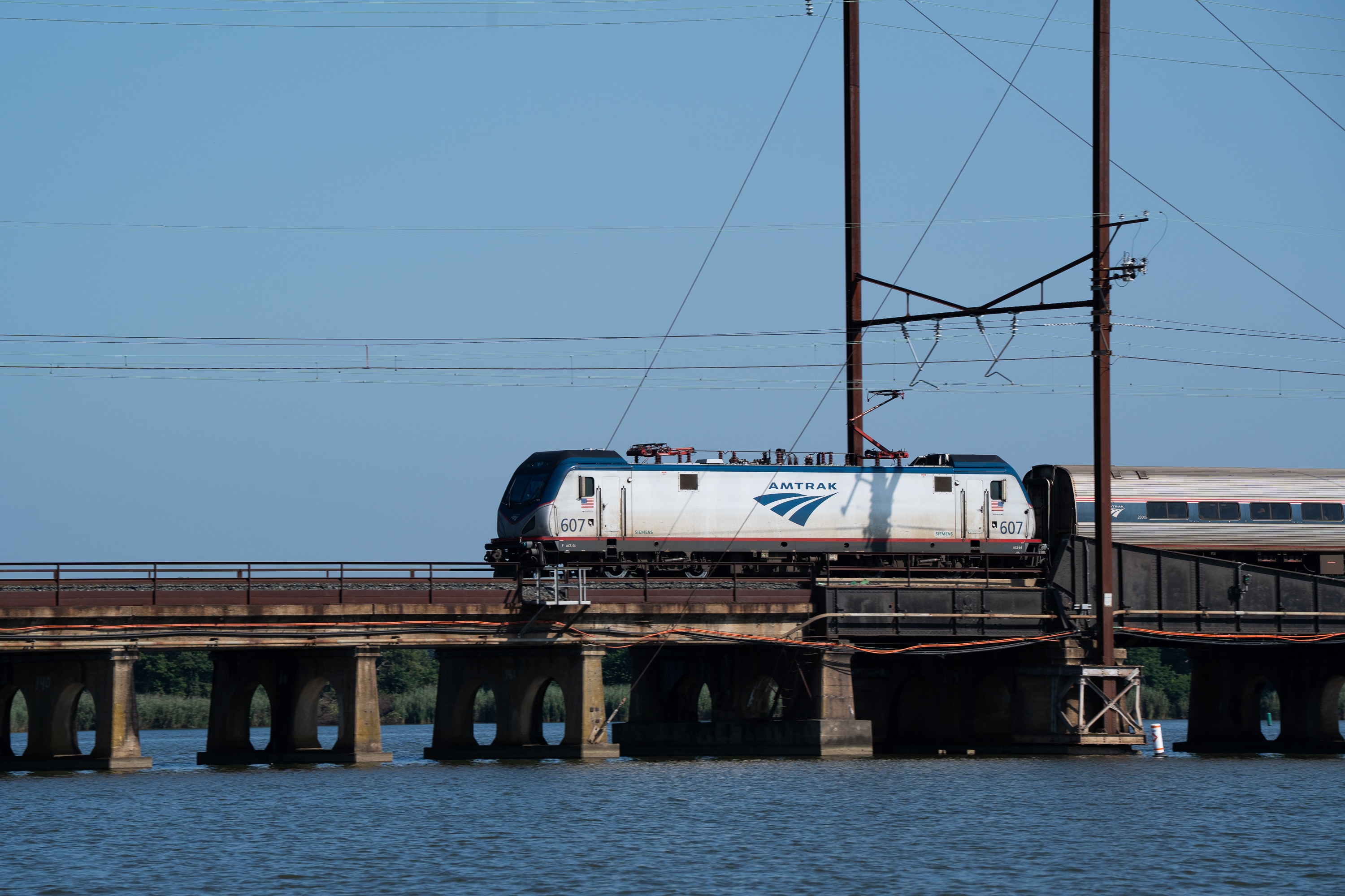 This file photo shows an Amtrak train on a bridge on the Gunpowder River in Baltimore County. Crews responded Thursday evening to a fire on an Amtrak train car in Essex.