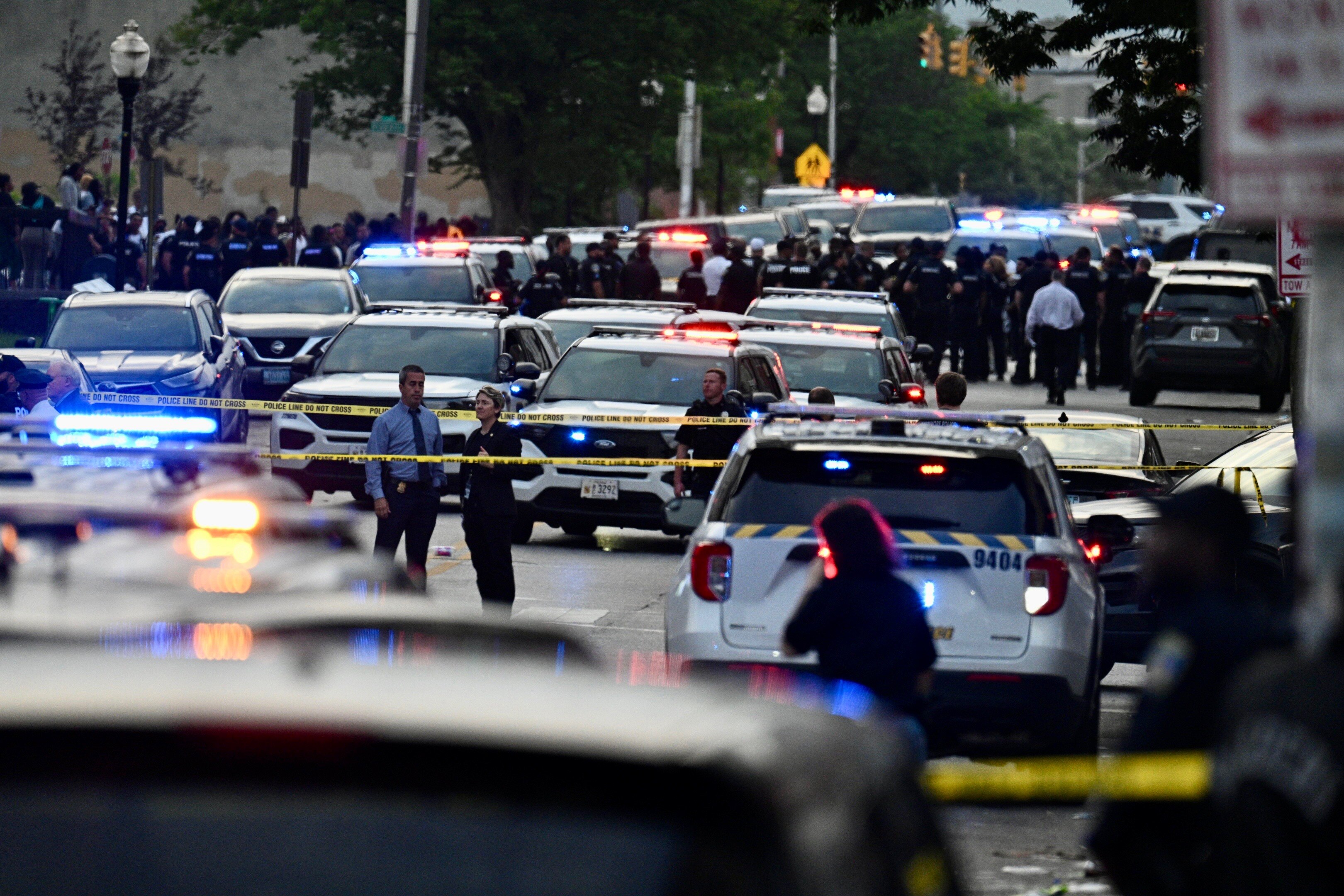 Dozens of law enforcement officers respond to a police-involved shooting in the Upton neighborhood of Baltimore on Tuesday evening.