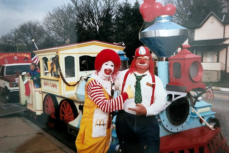Horney Sr. as Smokey the Clown posing with Ronald McDonald in front of the "McTrain."