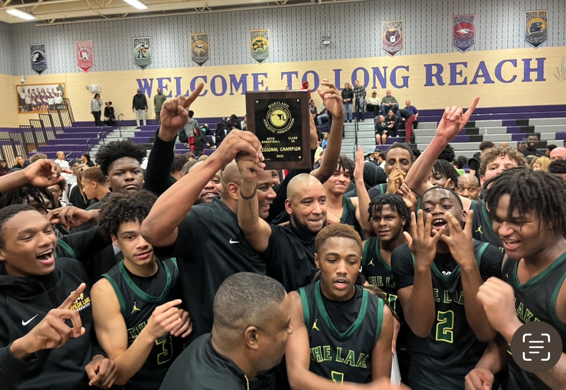 Wilde Lake boys basketball team celebrate after winning the Class 3A East Region 2 championship Thursday evening. The No. 15 Wildecats outlasted Howard County rival Long Reach, 86-76, in overtime, for their first region title since 2020.