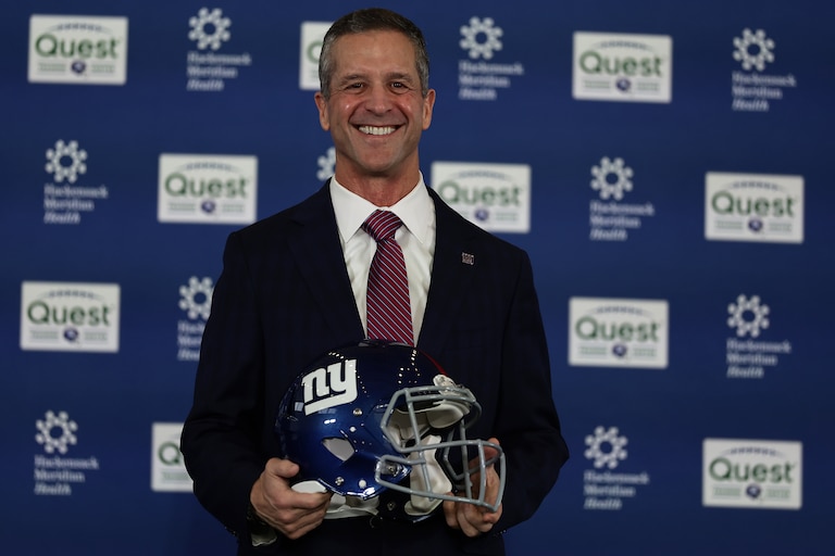 New York Giants head coach John Harbaugh poses for a photo after being introduced during a news conference Tuesday.