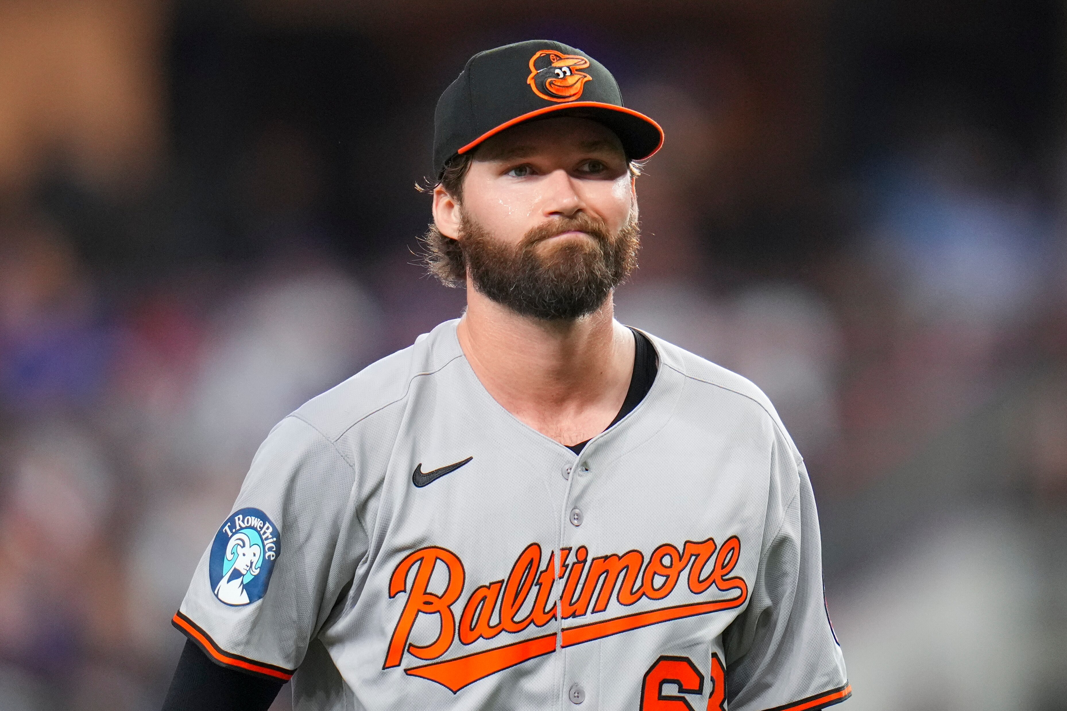 Orioles pitcher Brandon Young reacts after pitching to the Texas Rangers during the first inning.
