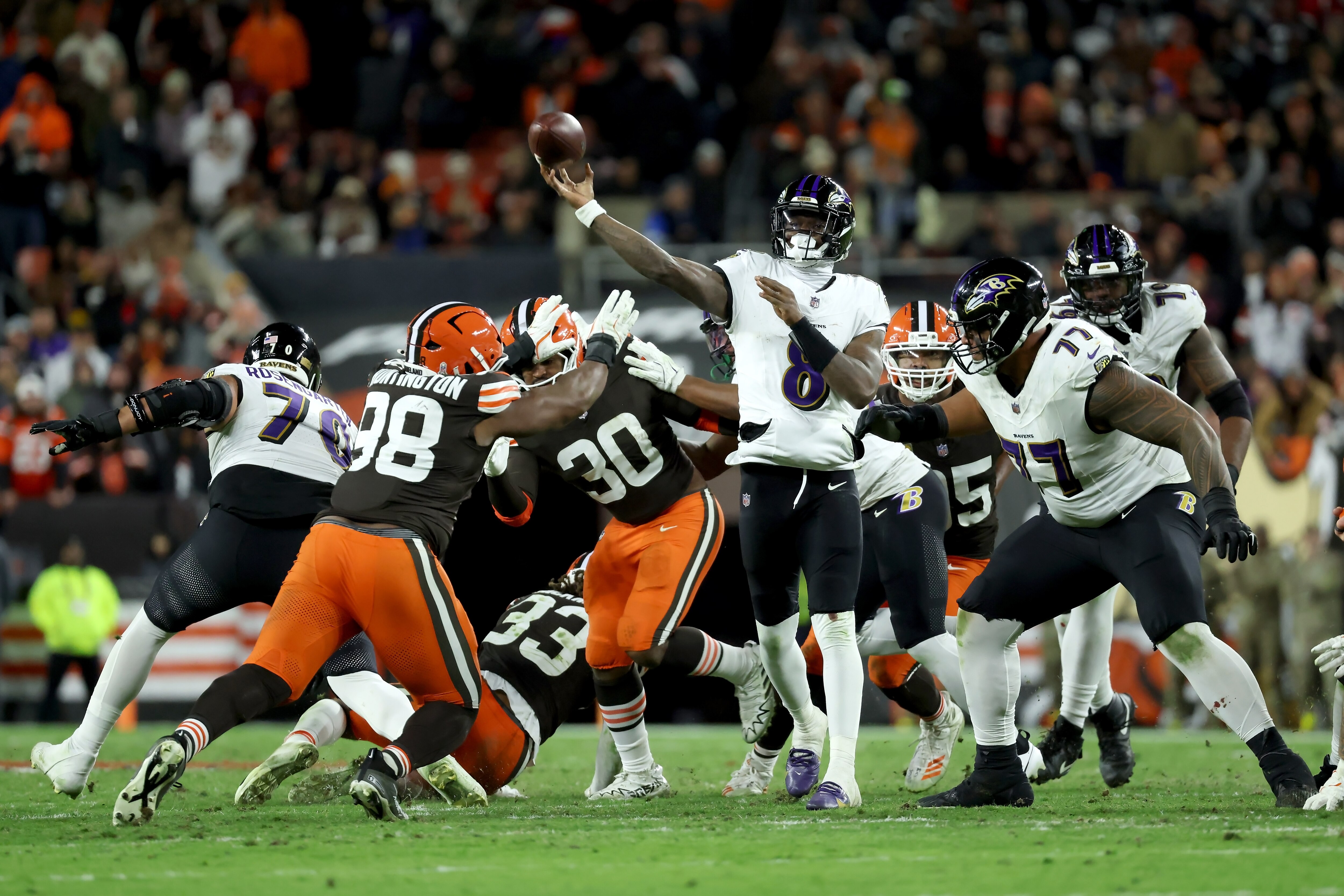 Ravens quarterback Lamar Jackson (8) throws the ball against the Cleveland Browns on Sunday, Nov. 16.