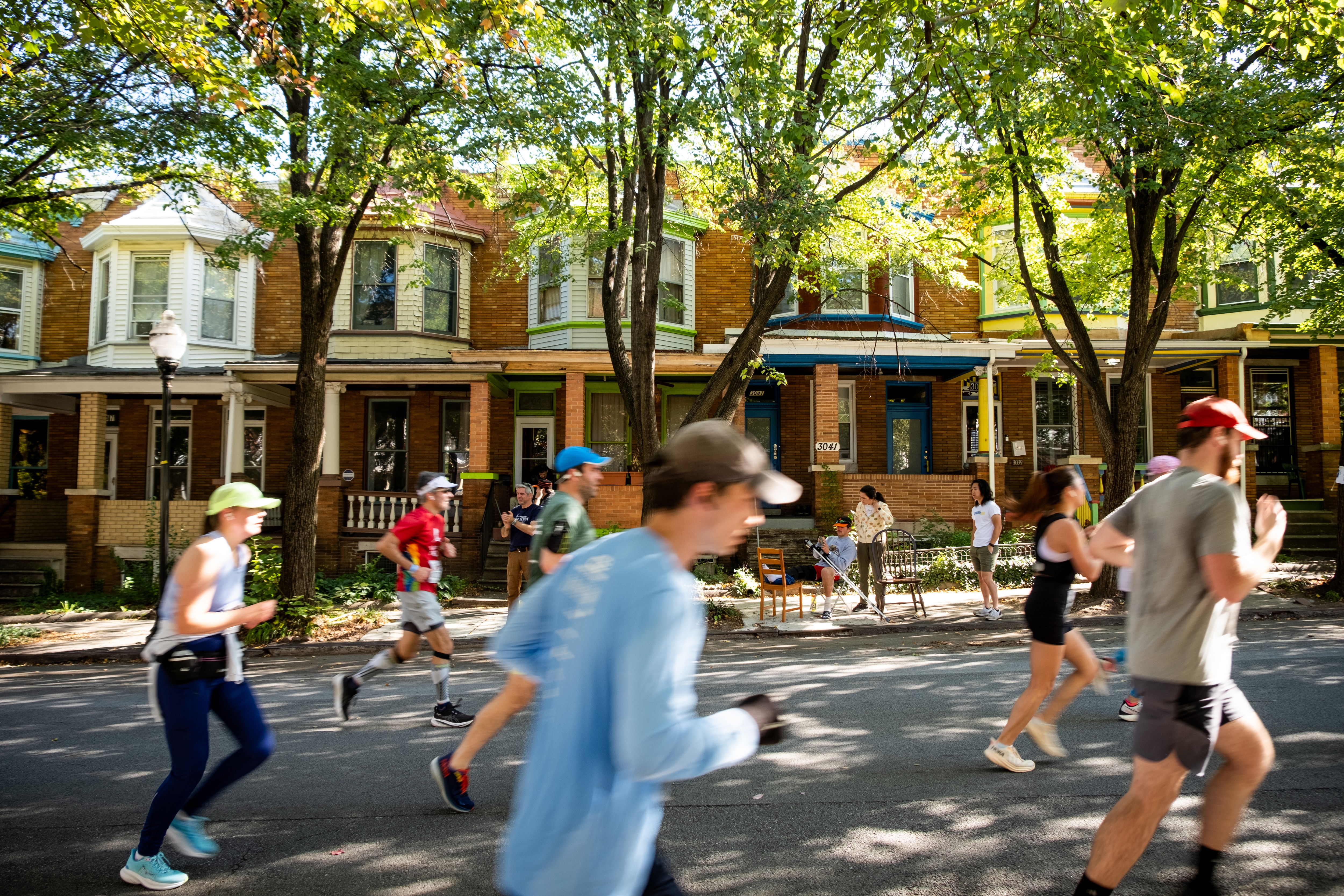 Runners pass through the Charles Village neighborhood during the 2024 Baltimore Running Festival on Saturday, October 19, 2024.