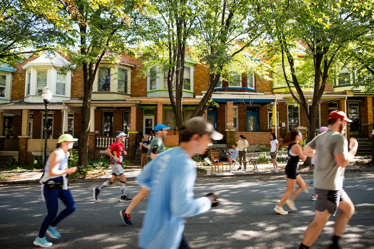 Runners pass through the Charles Village neighborhood during the 2024 Baltimore Running Festival on Saturday, October 19, 2024.