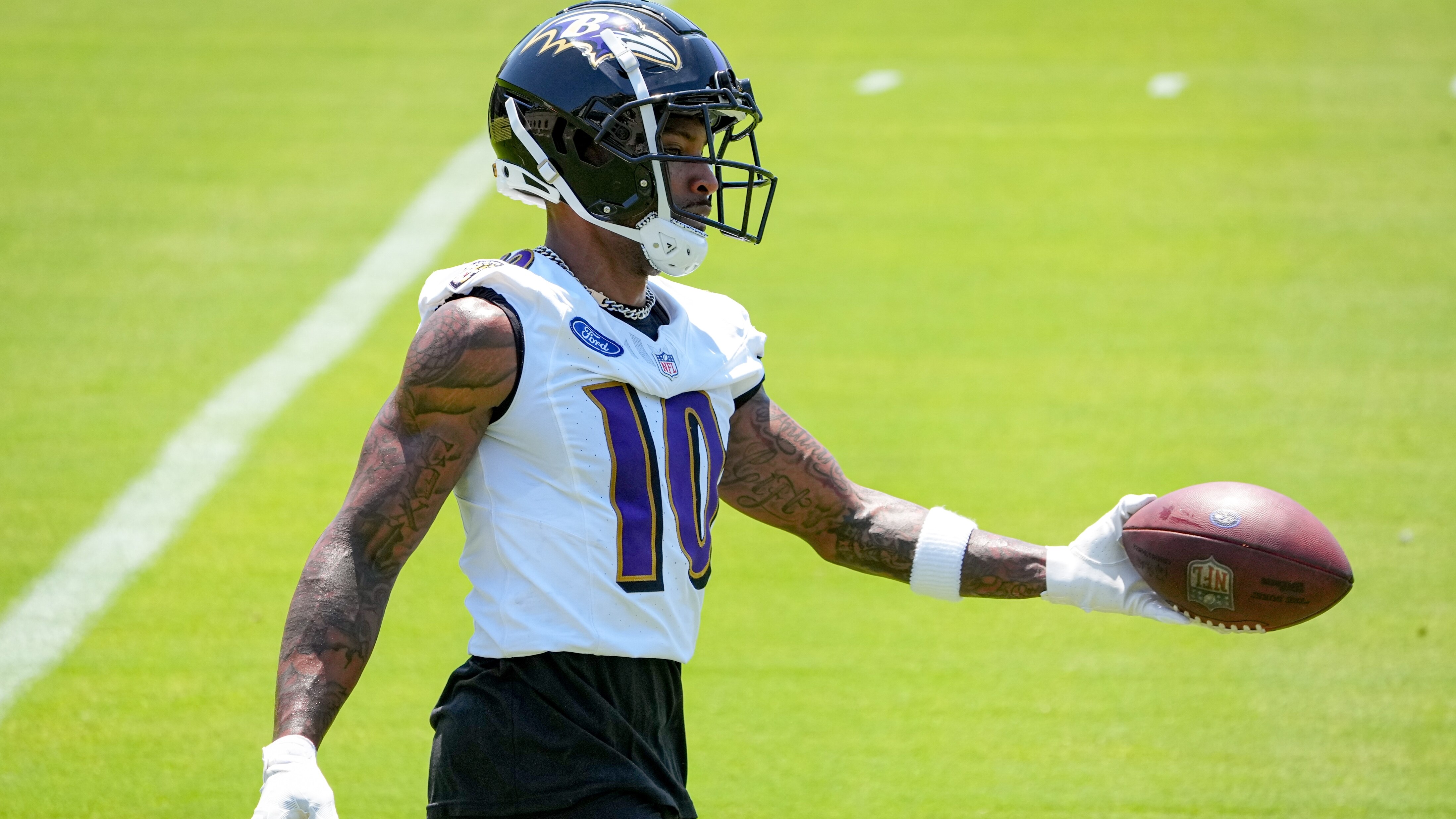 Baltimore Ravens cornerback Arthur Maulet (10) catches a football during practice at the Under Armour Performance Center in Owings Mills on May 22, 2024.
