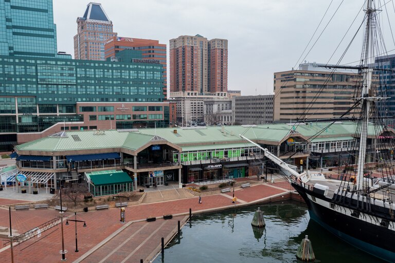 A view of Baltimore's Inner Harbor and historic ship taken with a drone on Friday, March 17. Several property and business owners say they have concerns about the low levels of foot traffic in the district, which they need to stay in business.