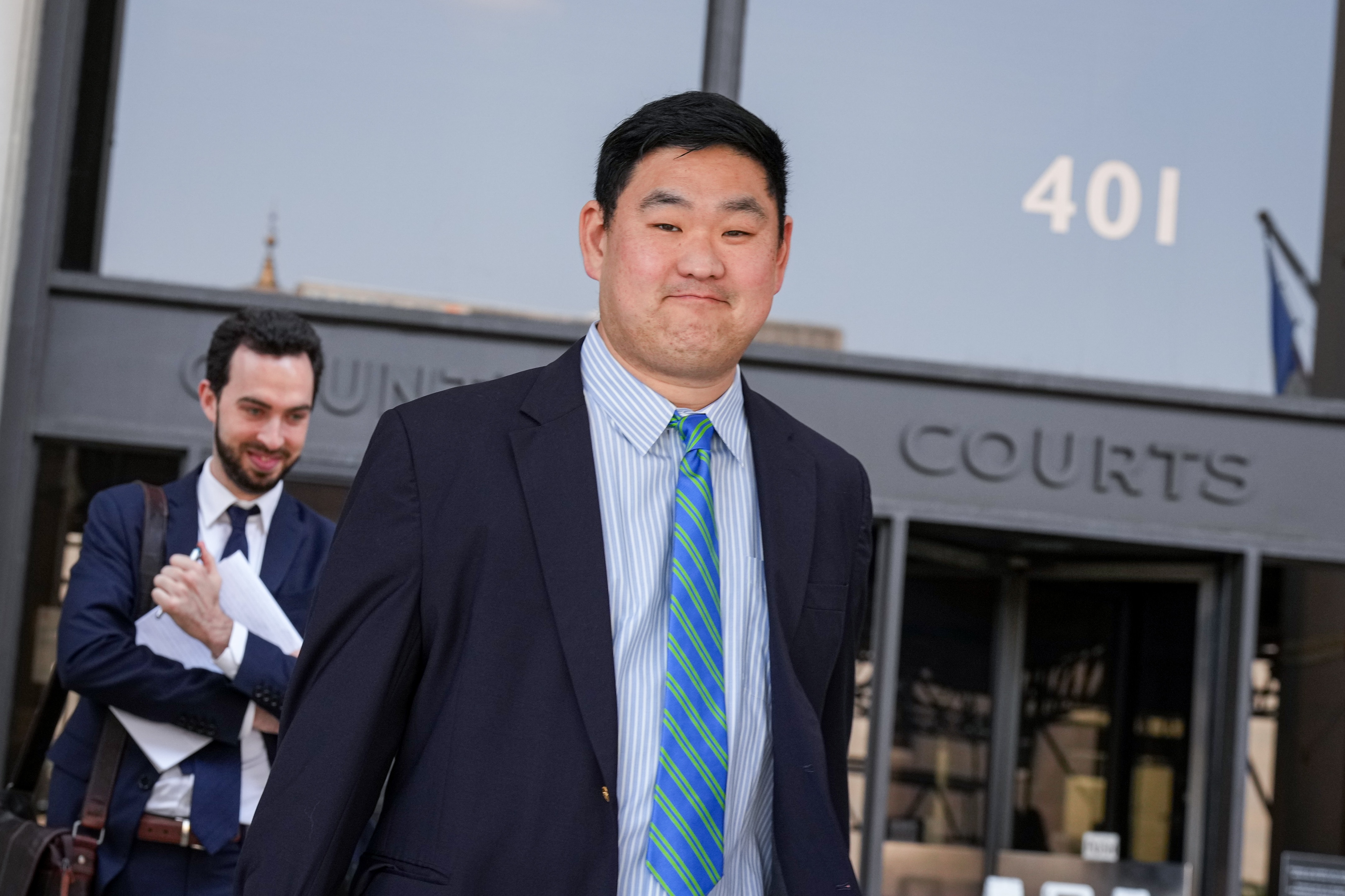 Chris Bendann, 39, exits the Baltimore County Courthouse in Towson with his legal team after a hearing on Tuesday, July 18, 2023. The former Gilman School teacher is accused of sexually abusing a student between 2016 and 2019, and was indicted on 16 counts including sexual abuse of a minor, rape and related offenses.