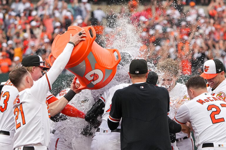 Baltimore Orioles left fielder Austin Hays (21) dumps gatorade on center fielder Cedric Mullins after he hit a sacrifice fly in the eleventh inning to win the game against the Tampa Bay Rays on Sunday, September 17, 2023. The Baltimore Orioles clinched a spot in the postseason for the first time since 2016.