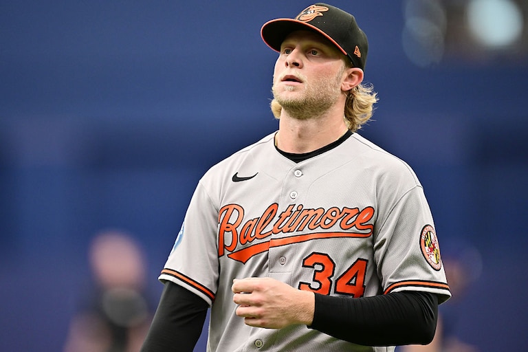 Orioles starting pitcher Shane Baz walks back to the dugout in the middle of the third inning.
