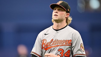 Orioles starting pitcher Shane Baz walks back to the dugout in the middle of the third inning.