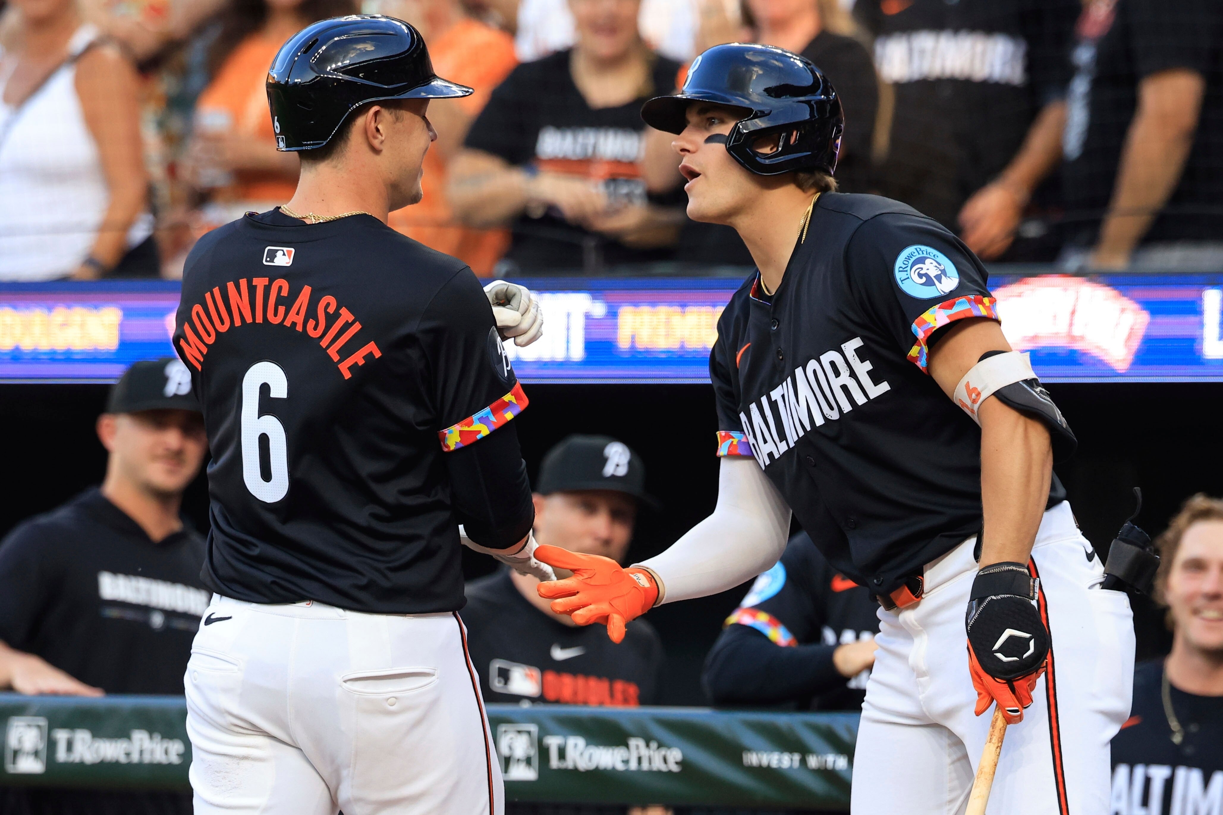 The Orioles' Ryan Mountcastle receives congratulations from Coby Mayo after hitting a first-inning home run Friday night at Camden Yards.