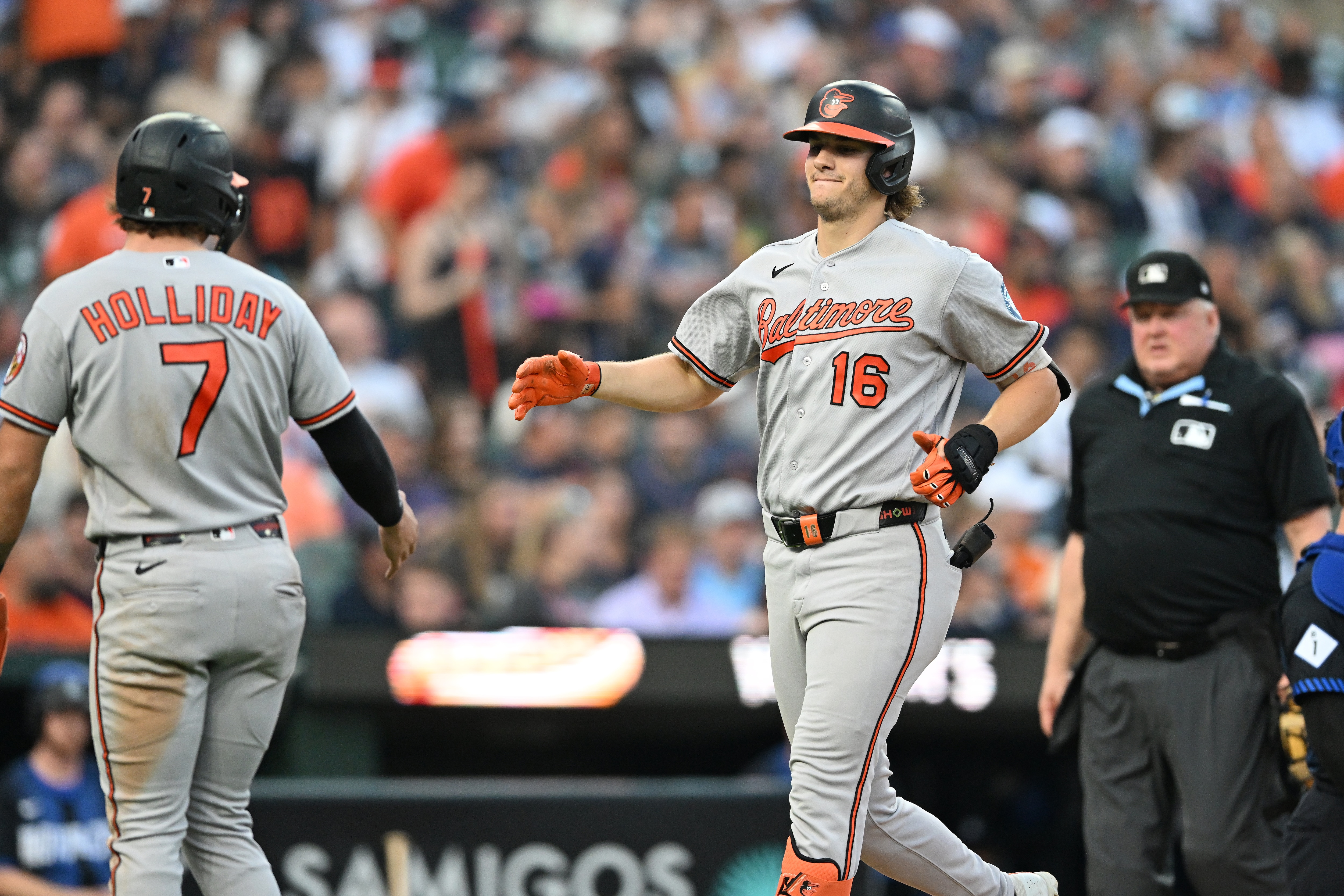 Orioles' Coby Mayo (16) is congratulated by Jackson Holliday (7) after hitting a two-run home run during the fifth inning.