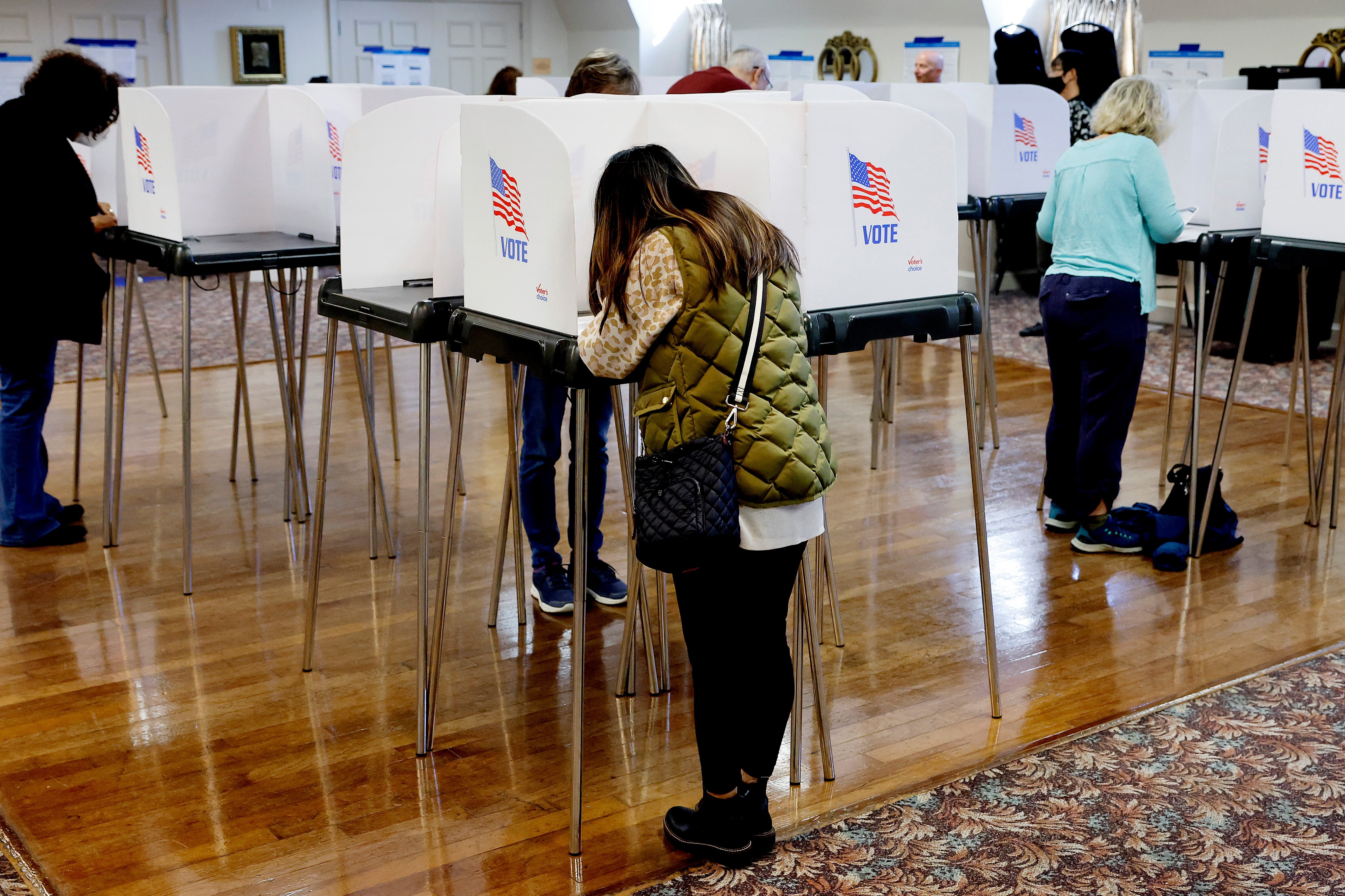 SANDY SPRING, MARYLAND - OCTOBER 27: Voters fill out and cast their ballots at the early voting location in the ballroom of the Sandy Spring Volunteer Fire Station on October 27, 2022 in Sandy Spring, Maryland. Including the site in Sandy Spring, Montgomery County opened 14 early voting sites on Thursday that will remain open through November 3. (Photo by Chip Somodevilla/Getty Images)