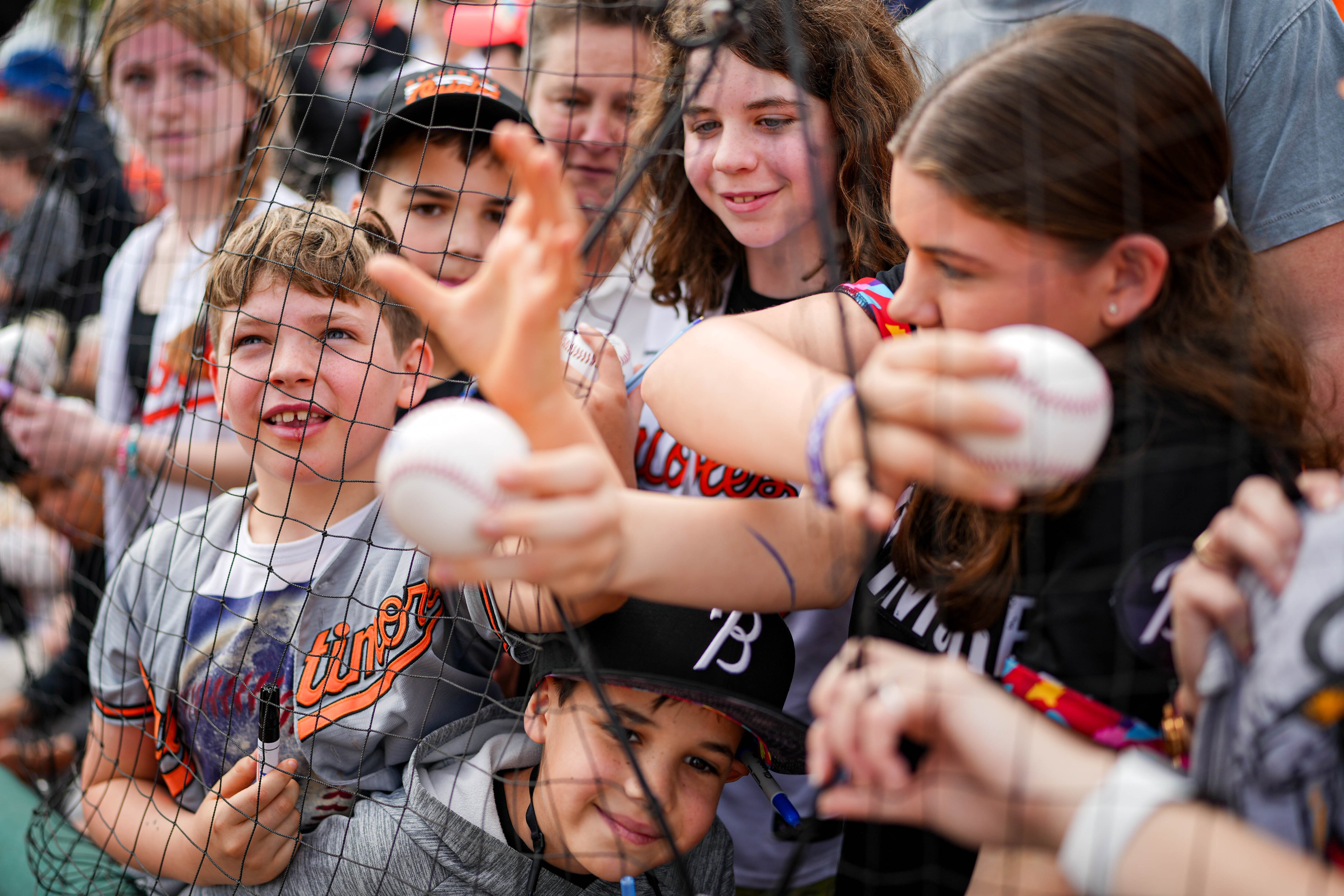 Young Baltimore Orioles fans beg for autographs ahead of a Grapefruit League game against the Pittsburgh Pirates at Ed Smith Stadium in Sarasota, Fla., last week.