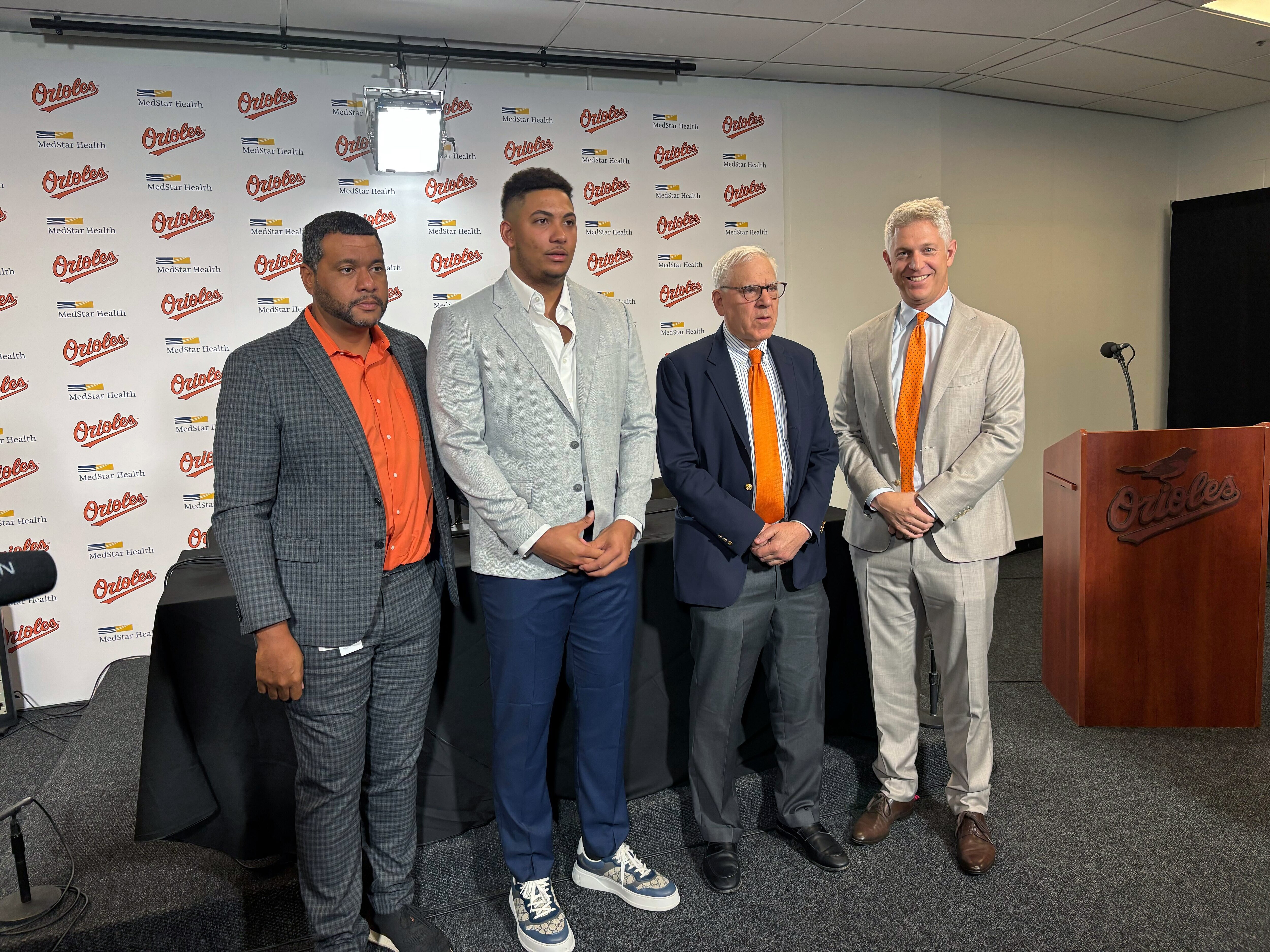 Orioles announced the eight-year contract extension of catcher Samuel Basallo. Samuel Basallo, international scouting director Koby Perez, general manager Mike Elias and owner David Rubenstein on August 23, 2025 at Camden Yards.