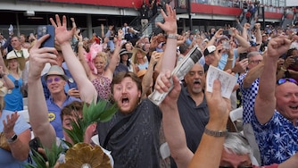 People celebrate from the apron as Journalism, ridden by Umberto Rispoli, wins the Preakness Stakes on Saturday, May 17, 2025.