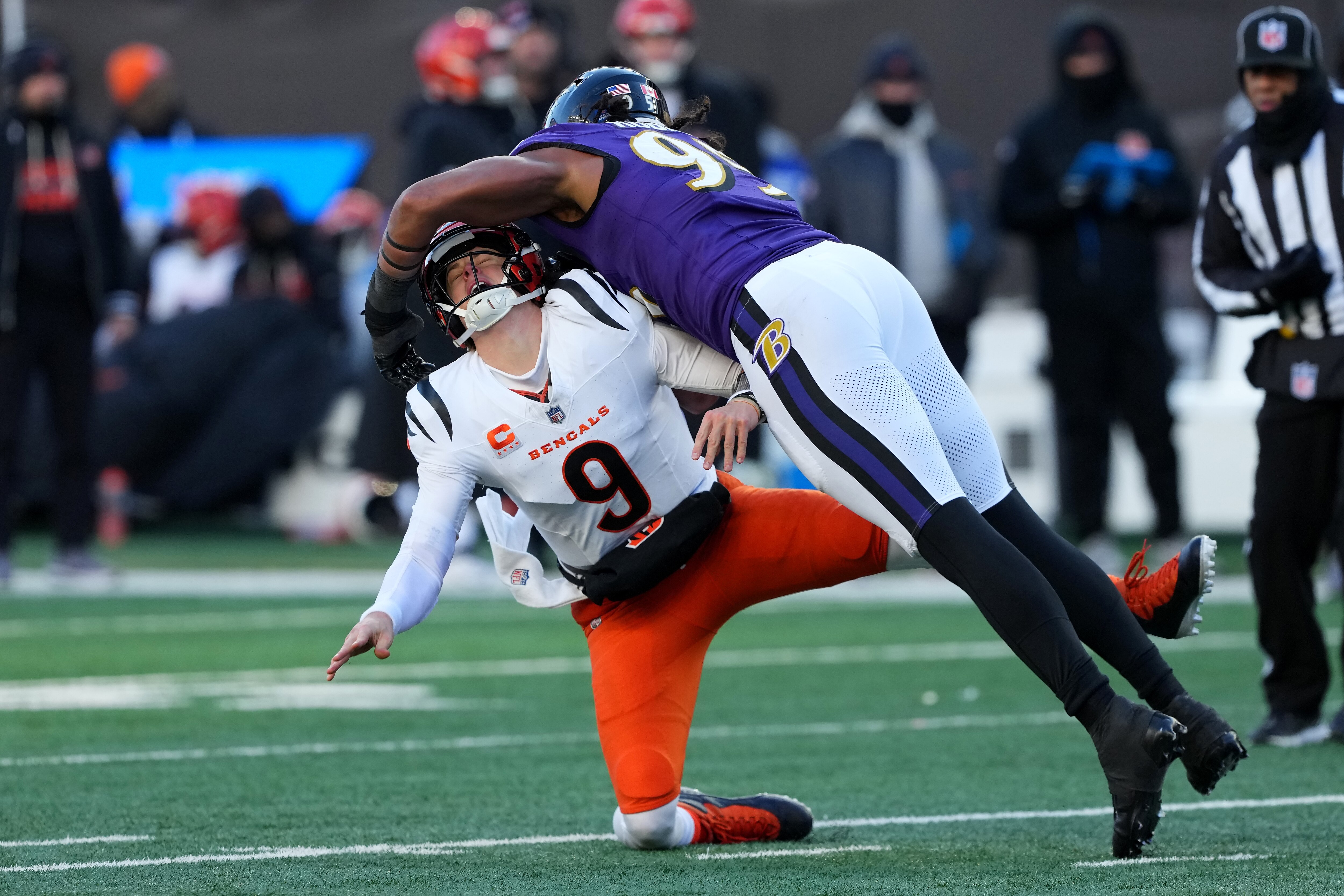 Ravens outside linebacker Tavius Robinson hits Bengals quarterback Joe Burrow during the fourth quarter, leading to an interception and a defensive touchdown. 