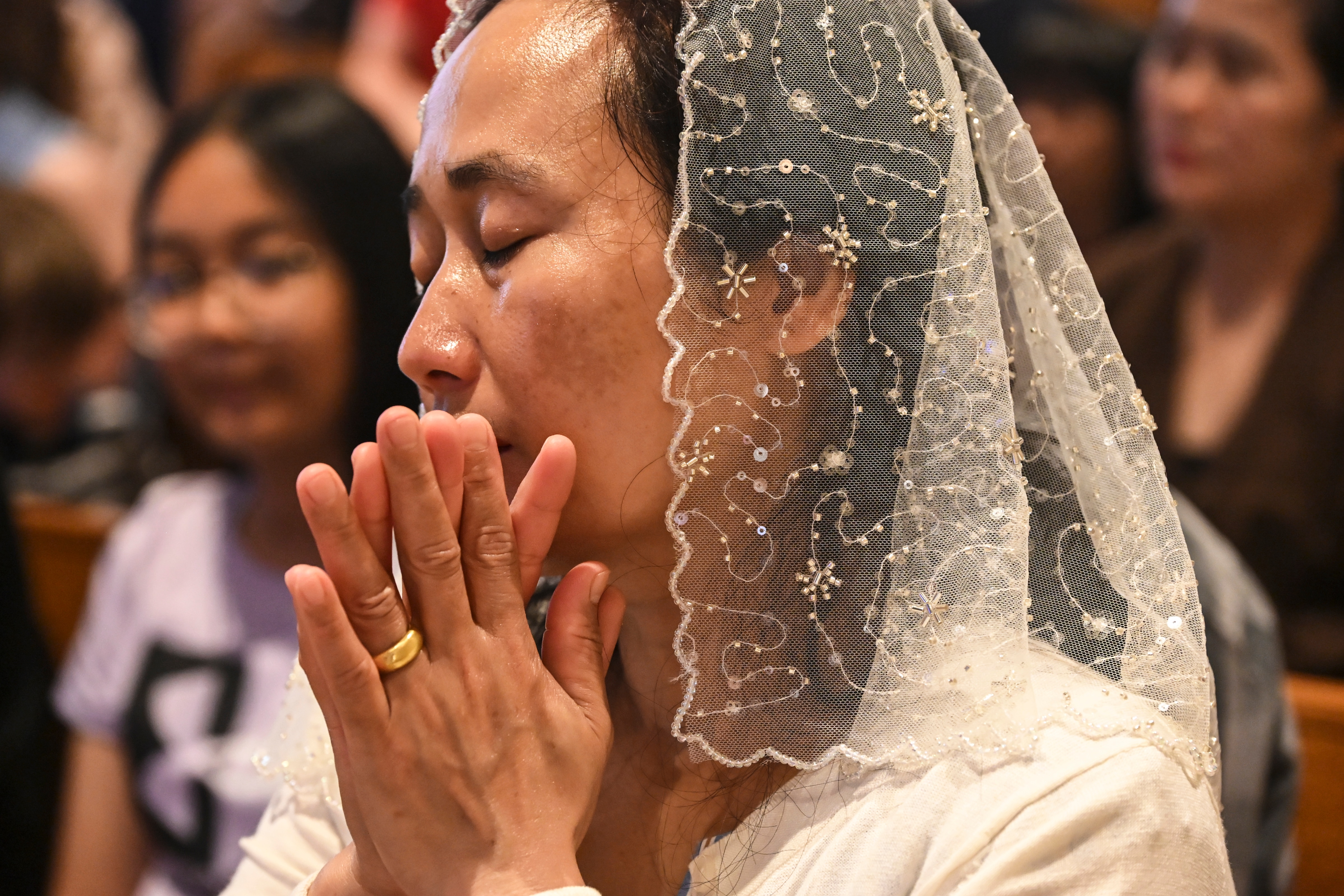 A community of Burmese immigrants organized pushback to the Archdiocese of Baltimore’s plan to close its church. Lun Khek, the extraordinary minister of communion at Our Lady of Victory, is pictured at a morning Mass on June 2, 2024.