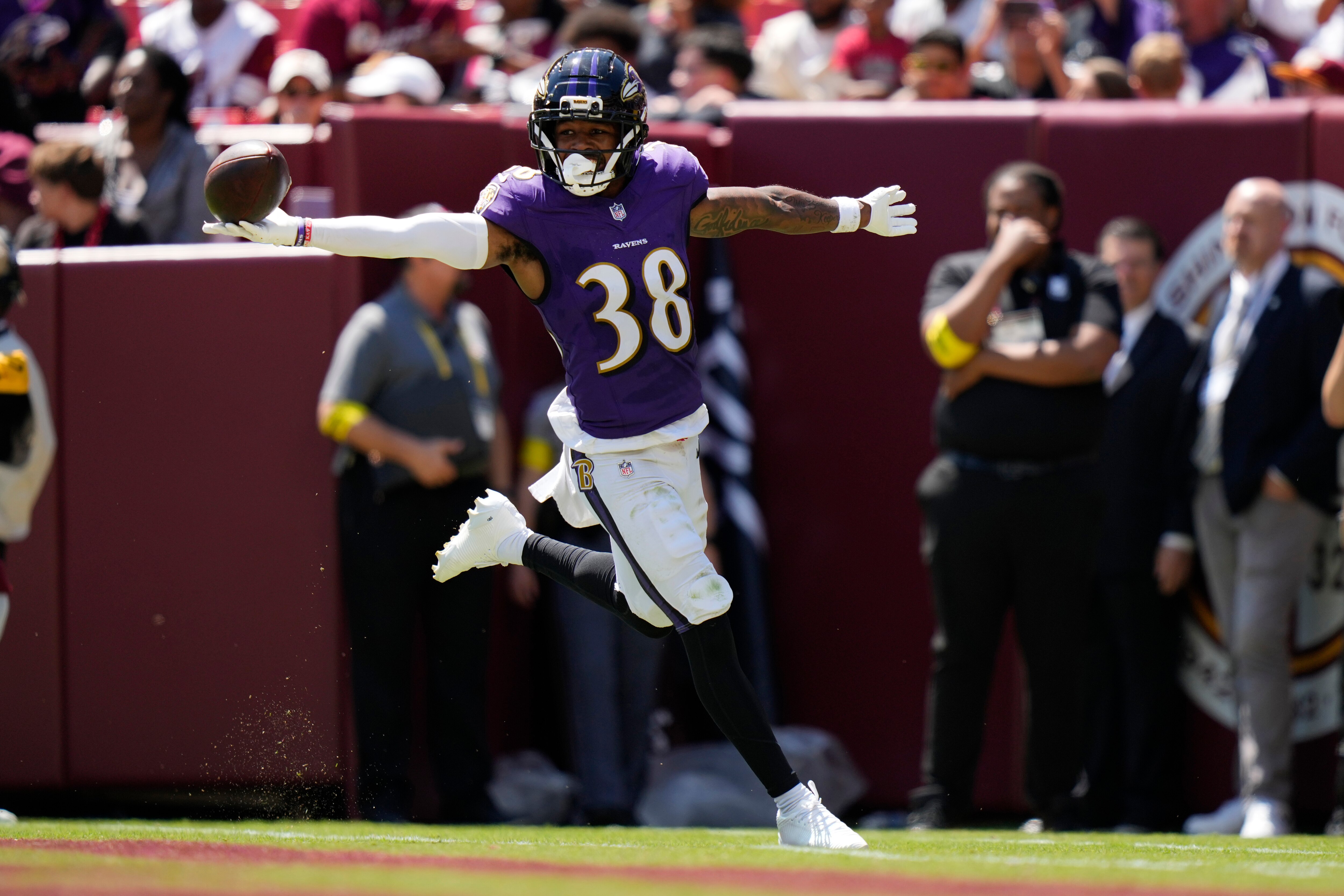 Baltimore Ravens cornerback Keyon Martin (38) celebrates after intercepting a pass and running it back for a touchdown during the first half of a preseason NFL football game against the Washington Commanders Saturday, Aug. 23, 2025, in Landover, Md.